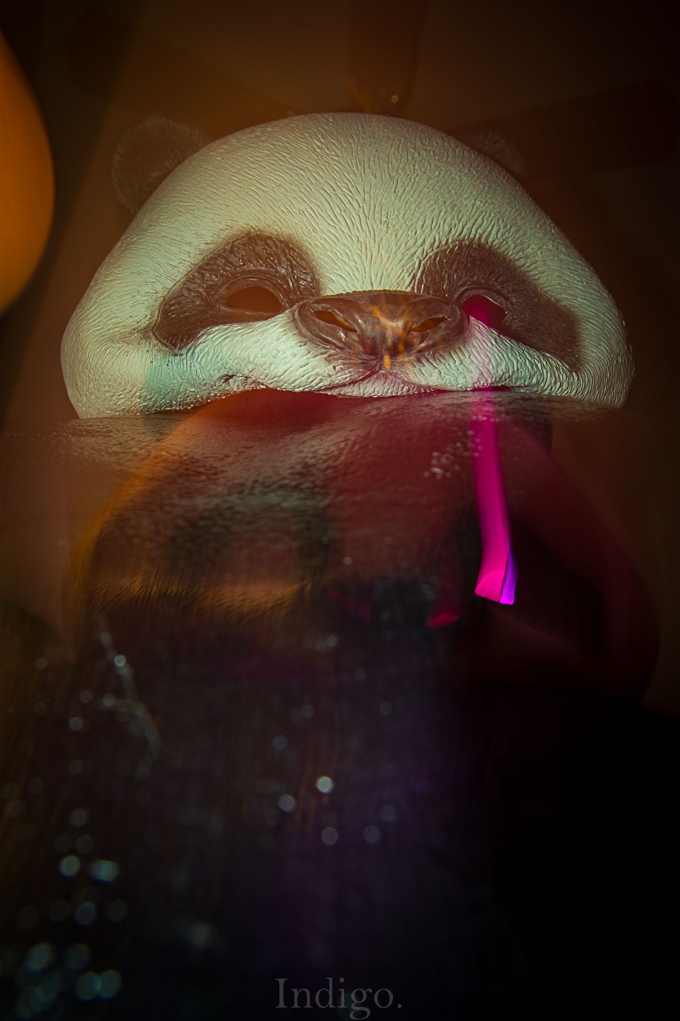 Artistic close-up of a glowing mushroom-like shape with pink lighting effects.