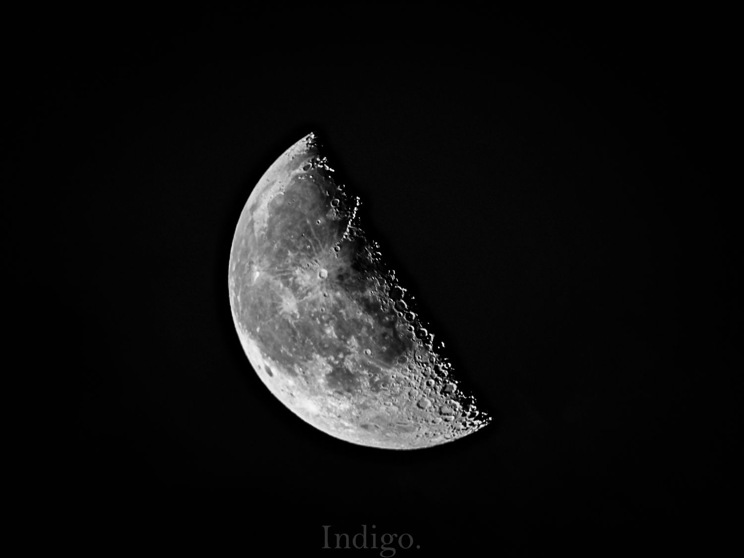 A sequence of eight black and white photographs showing different phases of the moon from full to crescent.