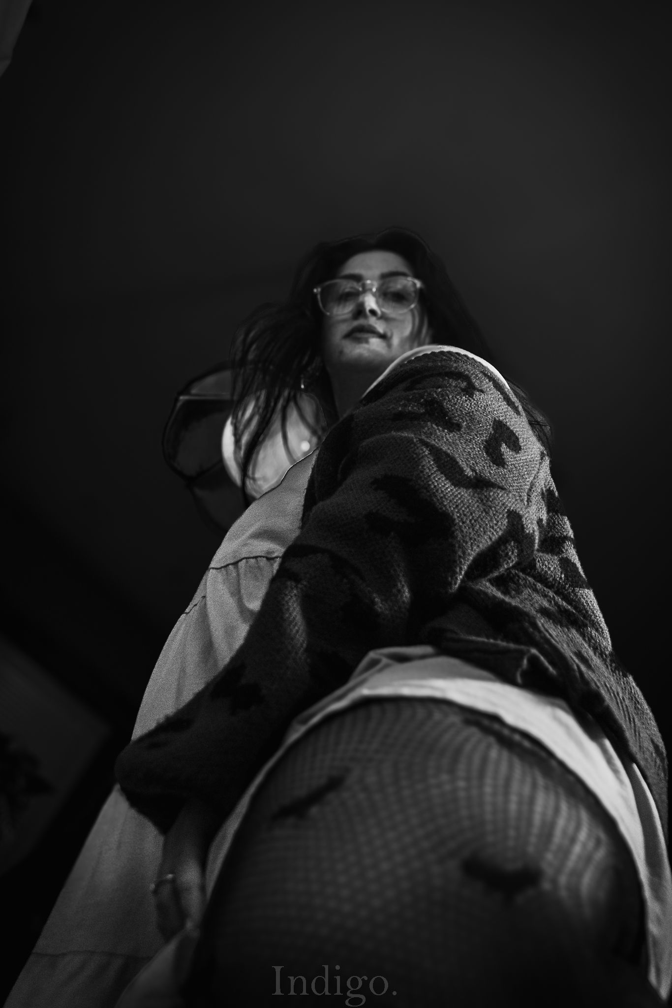 Dark moody portrait series showing dramatic shadows and textures of clothing.