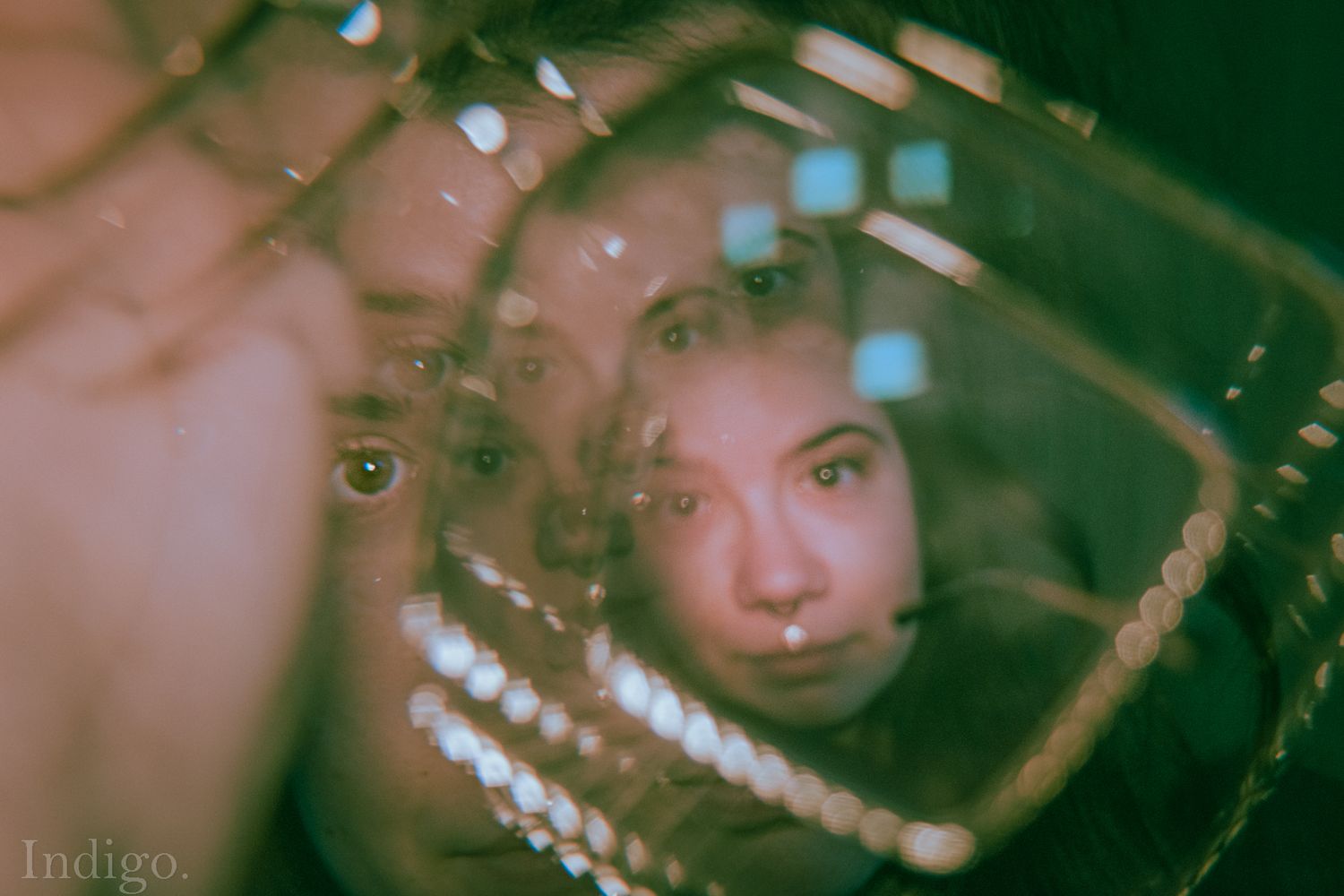 Artistic portrait with soft green lighting and shadows creating a dreamy atmosphere.