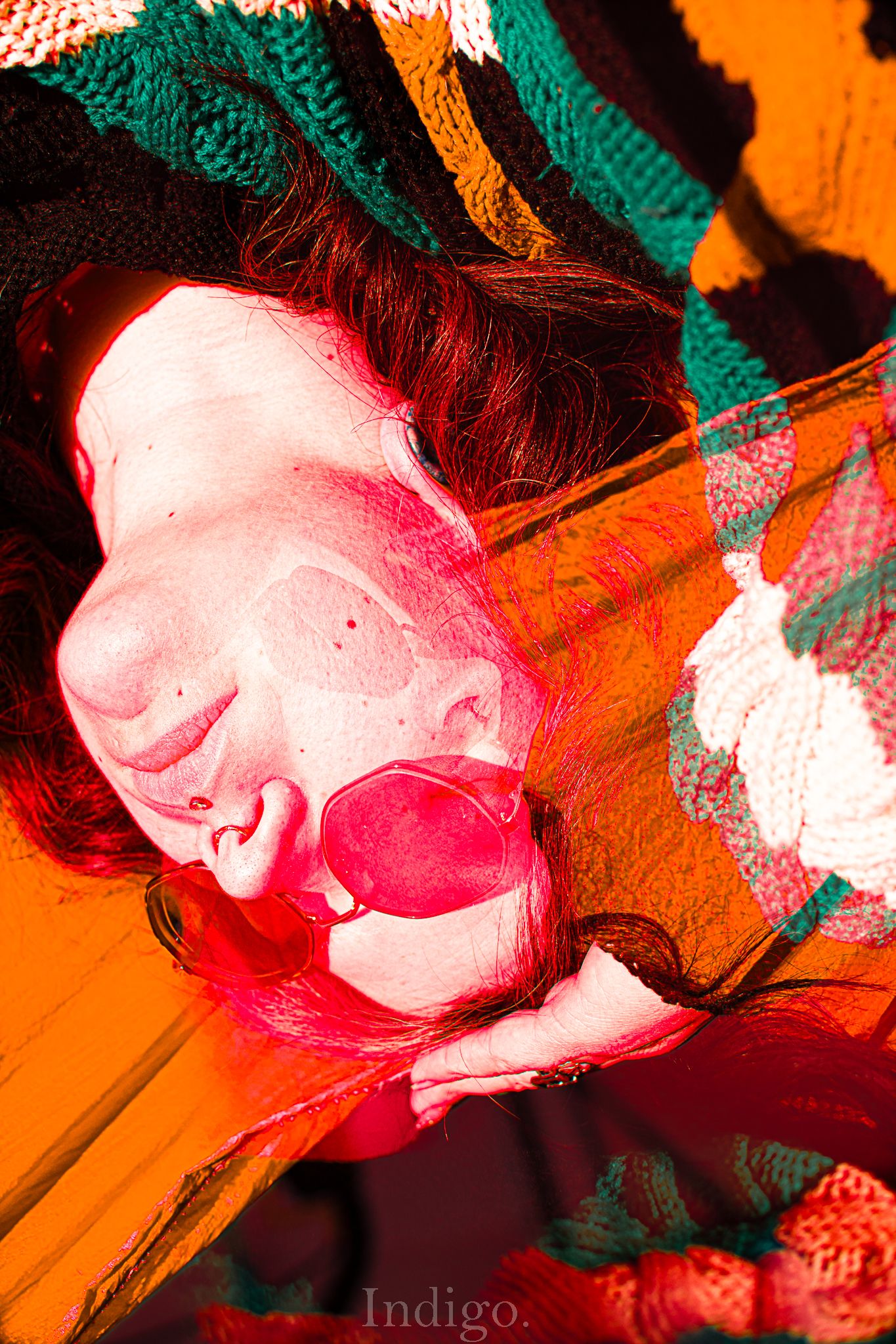 Vibrant abstract portrait with orange and green color overlays creating artistic effect.