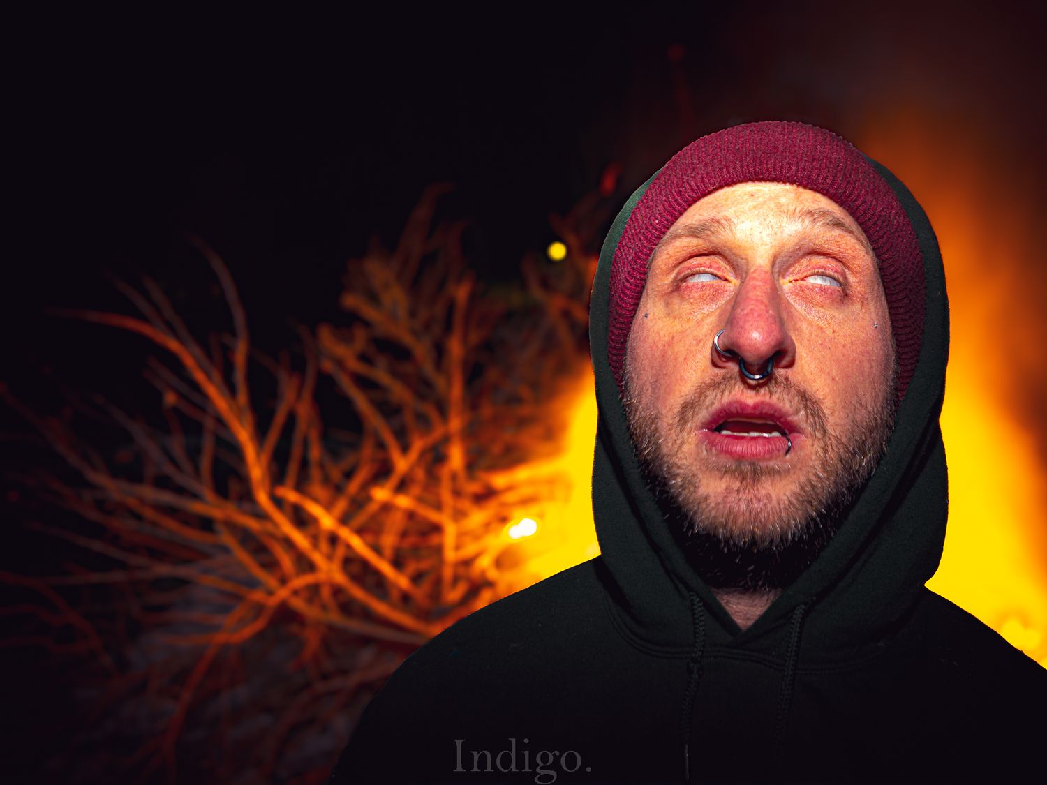 Series of dramatic portraits in low light showing someone wearing a burgundy beanie against an orange glow.