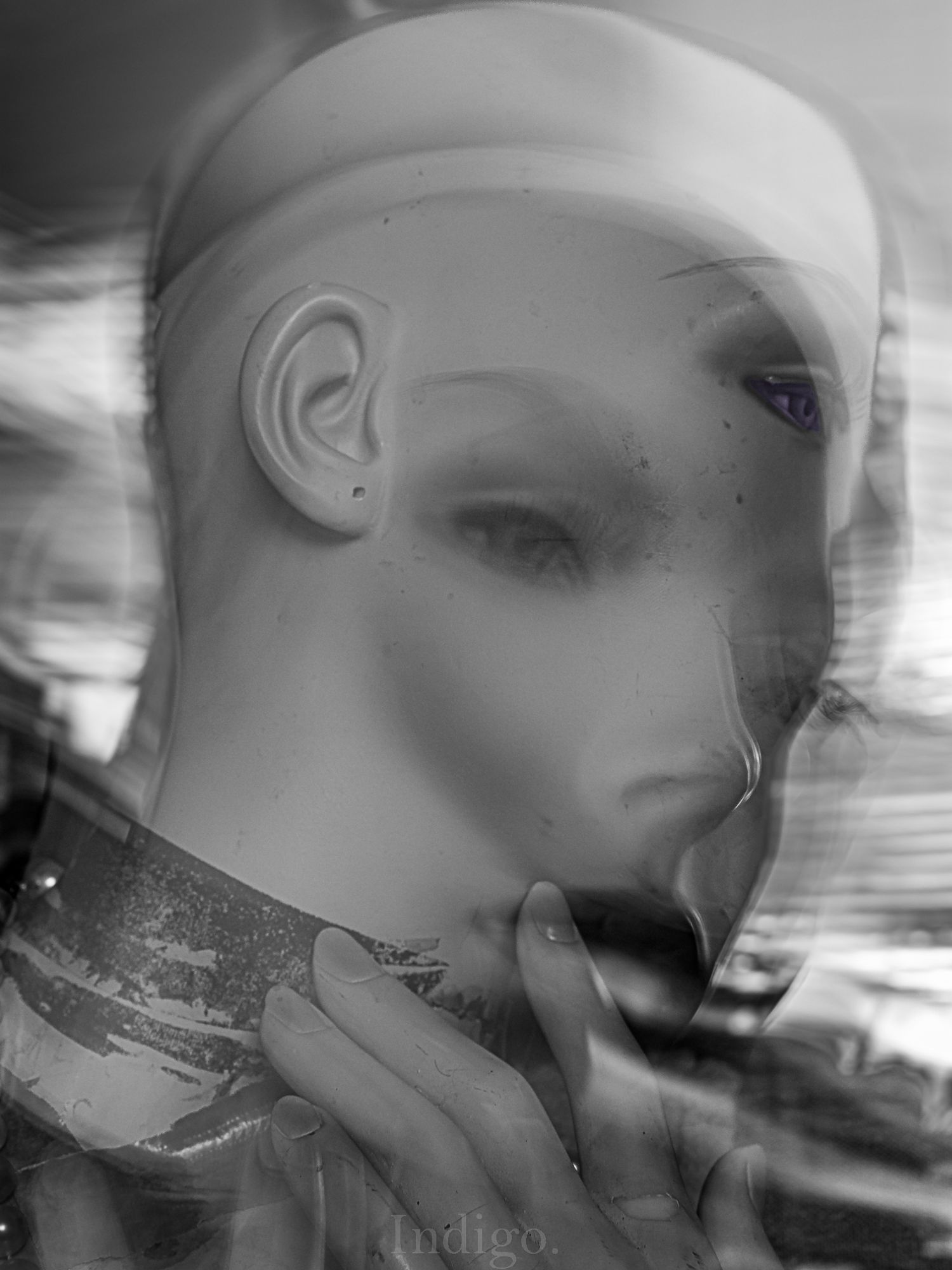 Artistic black and white portrait with motion blur and ethereal lighting effects.