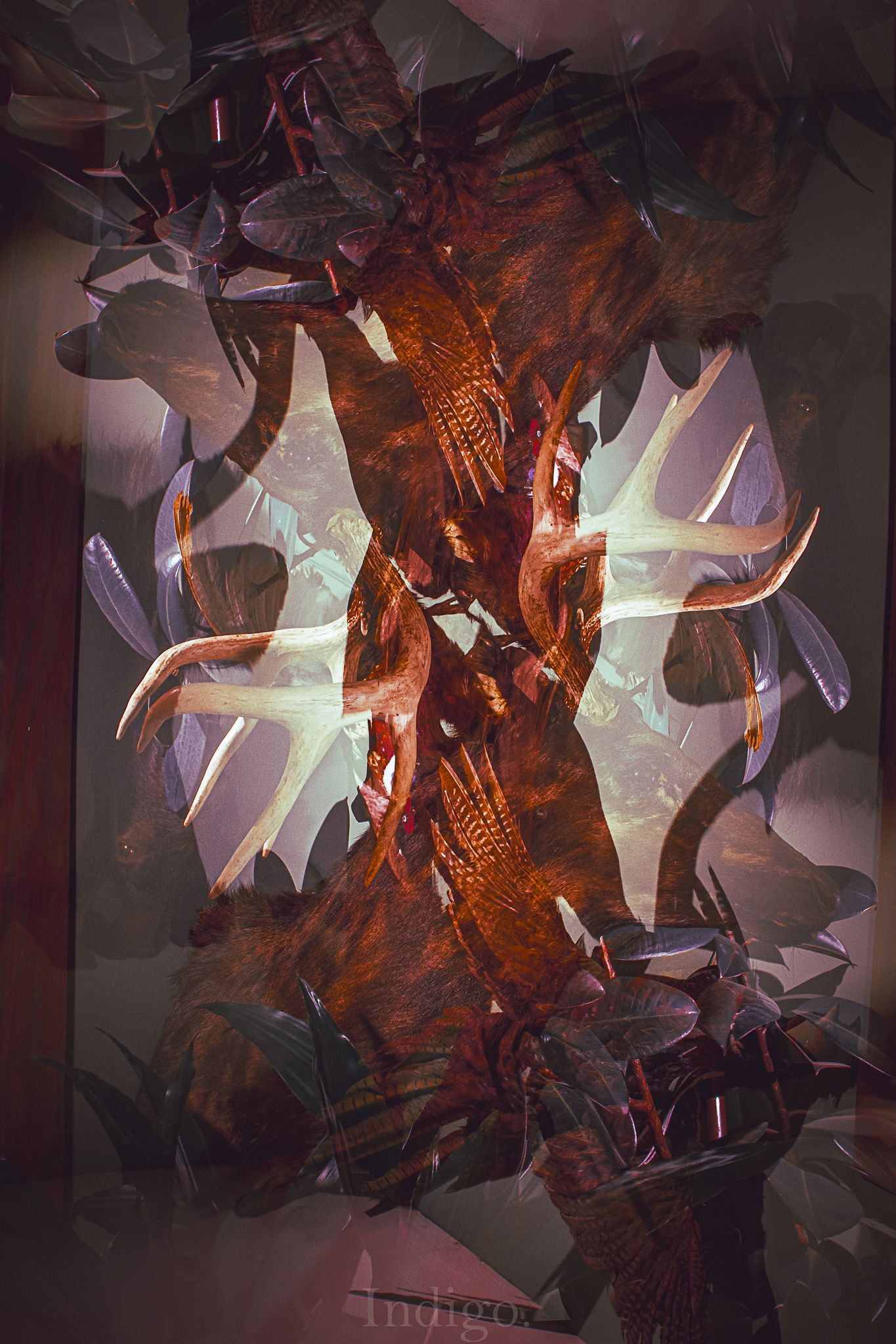 Abstract digital artwork with angular geometric shapes in dark red and purple tones creating a fragmented composition.