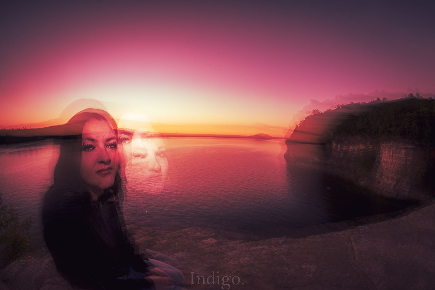 Dramatic purple and orange sunset sky over a dark horizon creates a stunning panoramic view.