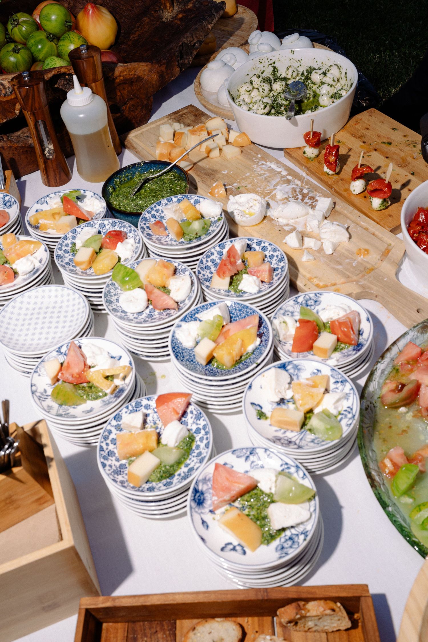 Elegant table setting with blue and white plates filled with fresh appetizers.