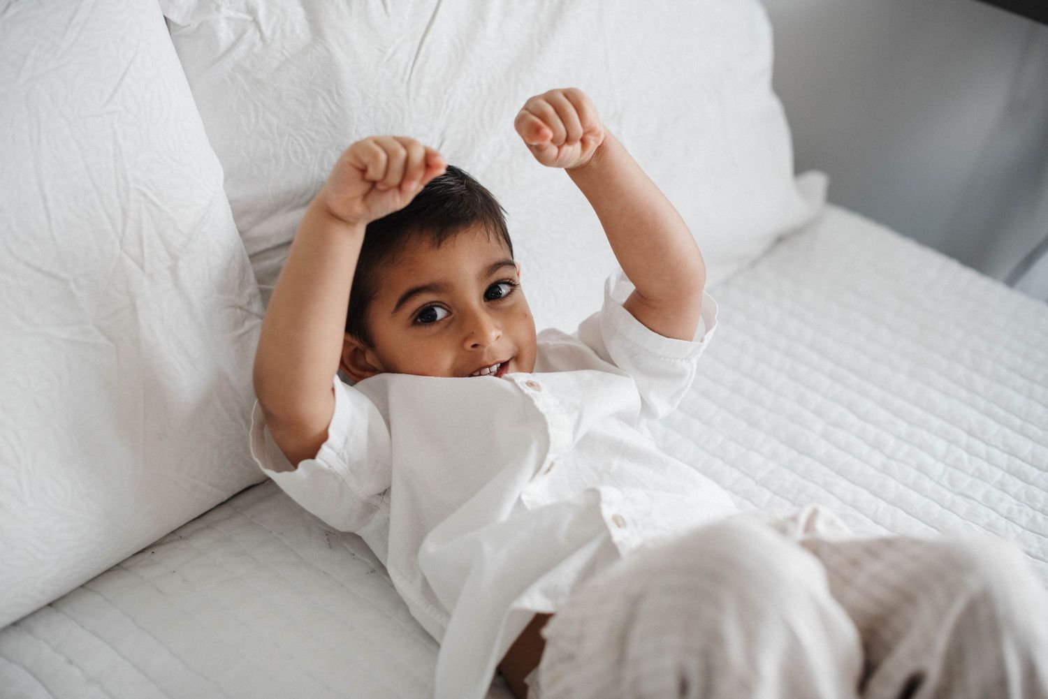 Oakville lifestyle family photography showing parents and children laughing together
