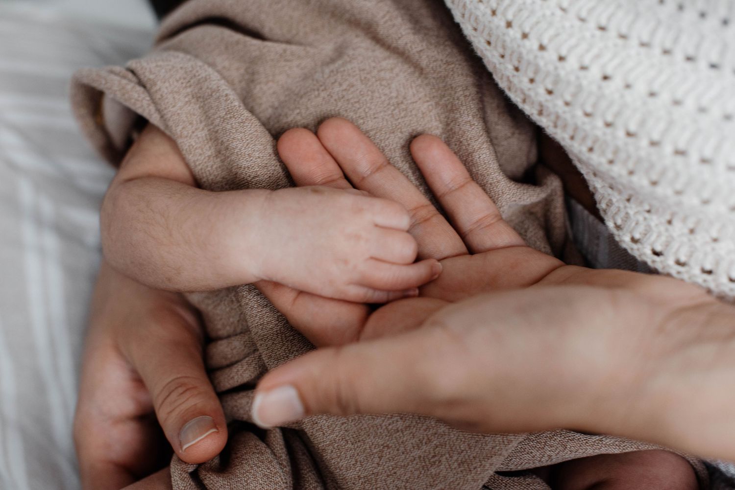 In-home maternity photography session with soft light and connection