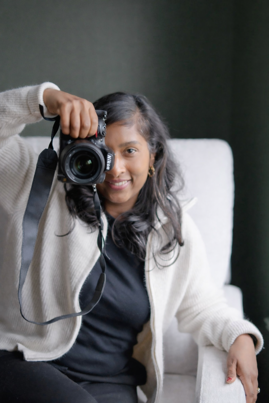 Candid portrait of Oakville family photographer Ara Pereira in home environment