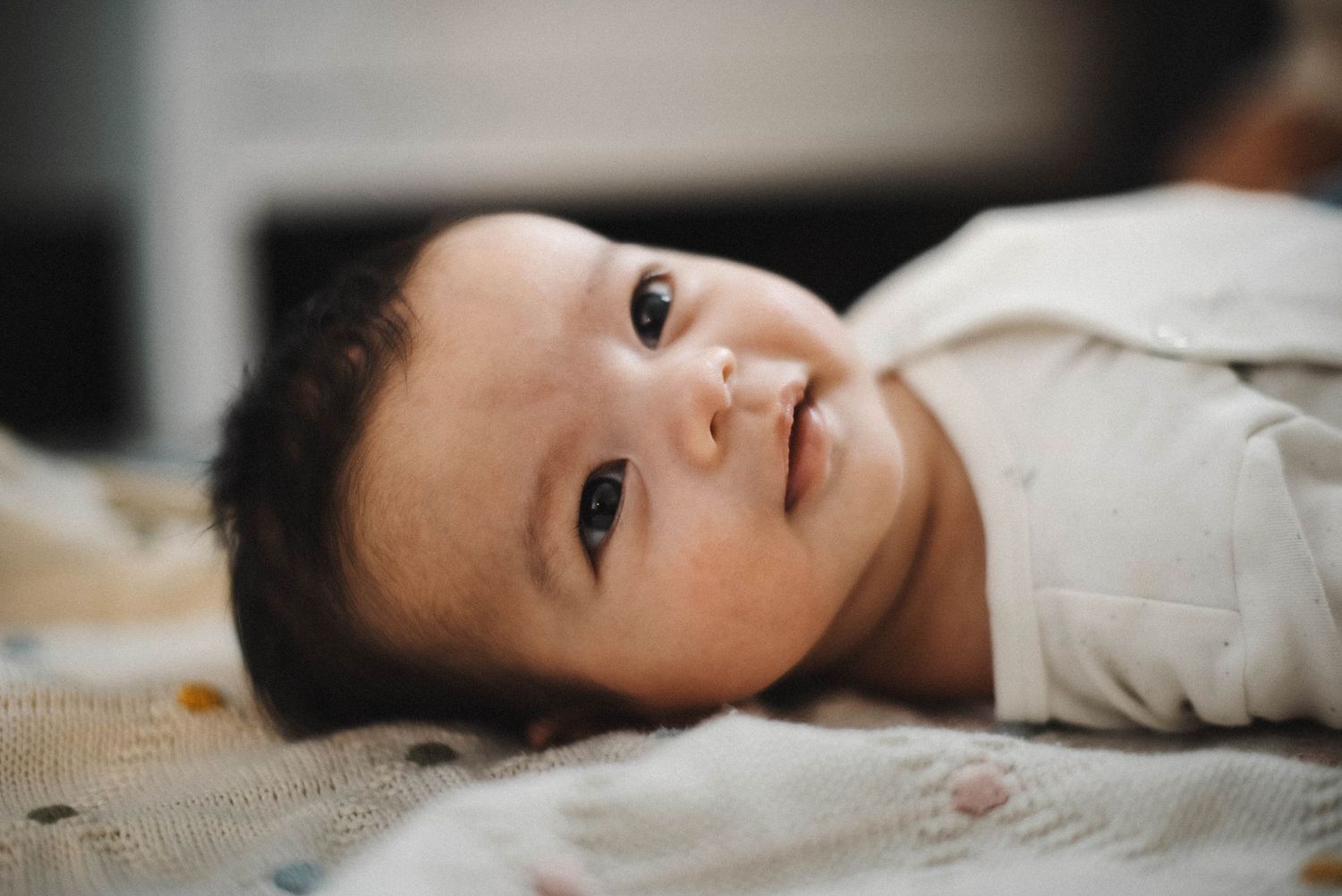 Oakville lifestyle photographer Ara Pereira capturing candid baby smiles