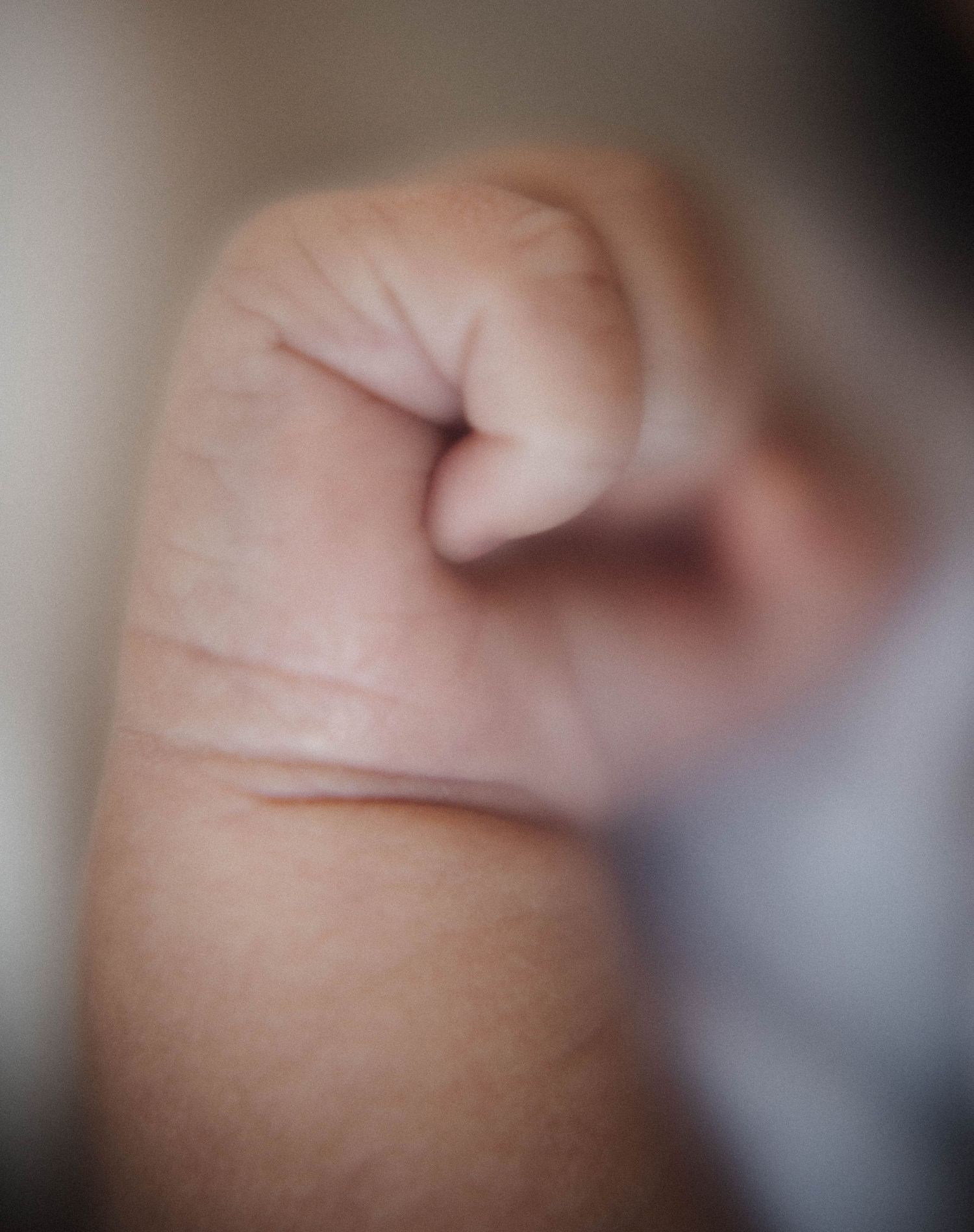 Oakville photographer capturing baby hands curled up into a fist