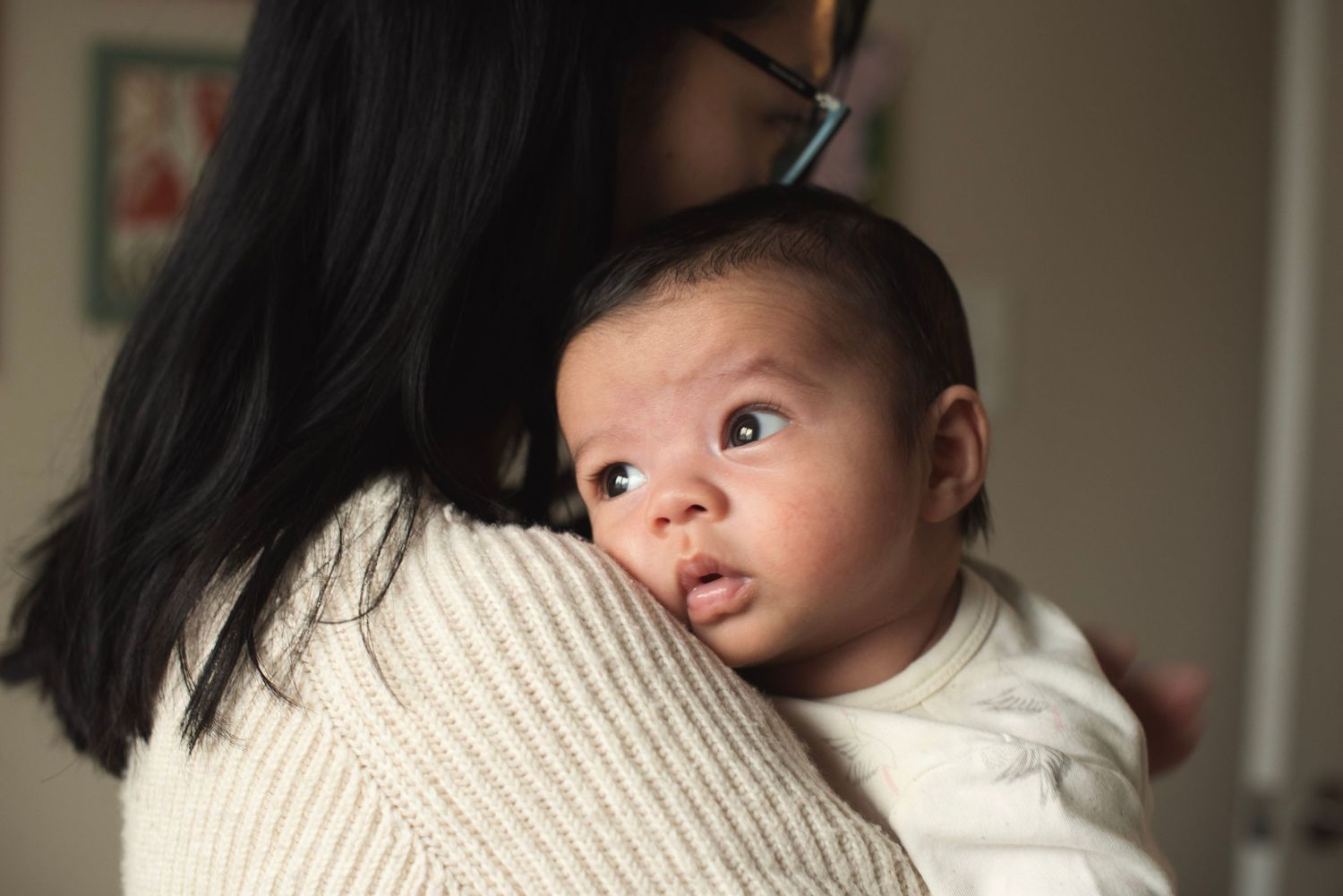Oakville baby photographer capturing mother and baby in a candid quite moment