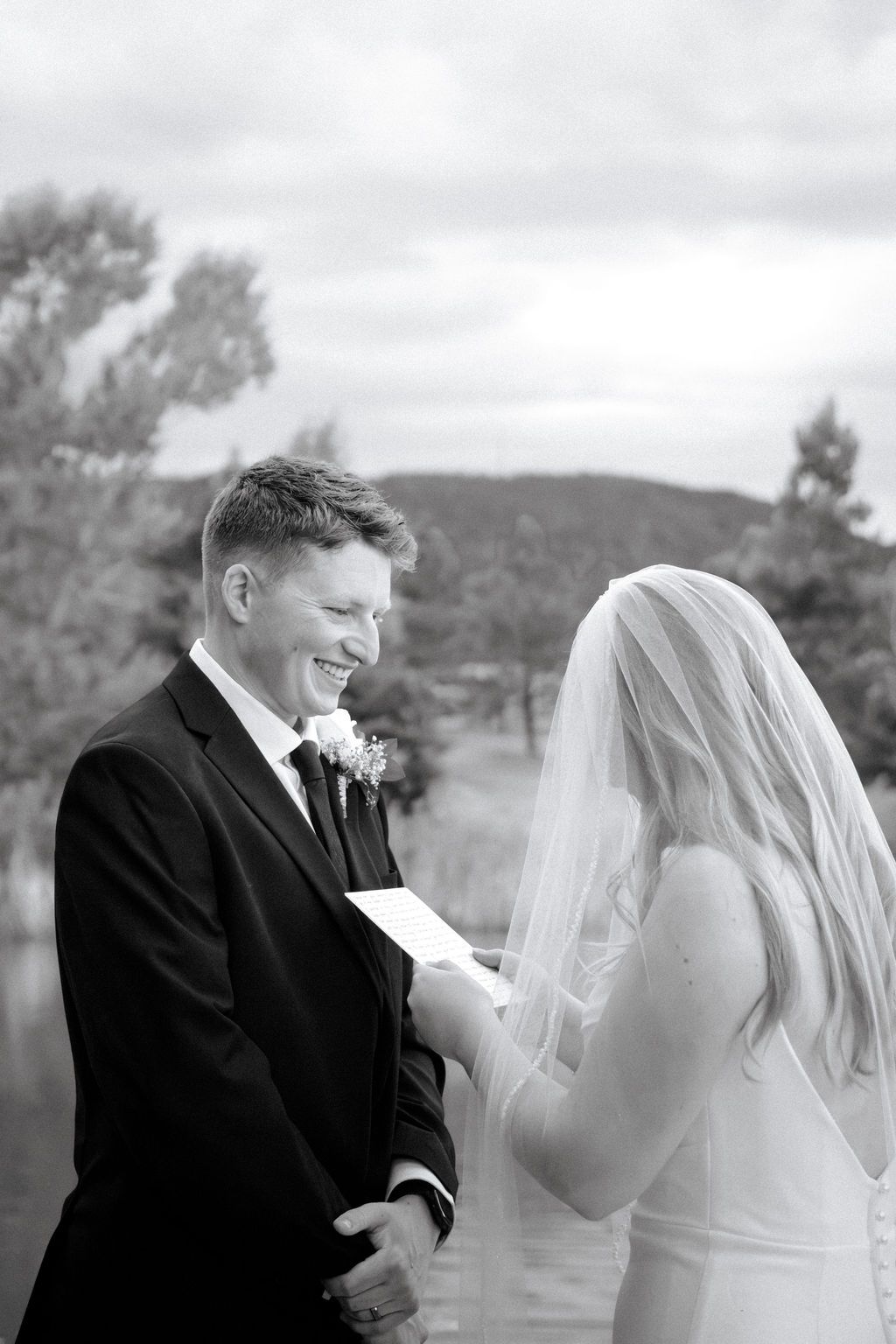 Bride and groom exchange private vows in Colorado mountain wedding