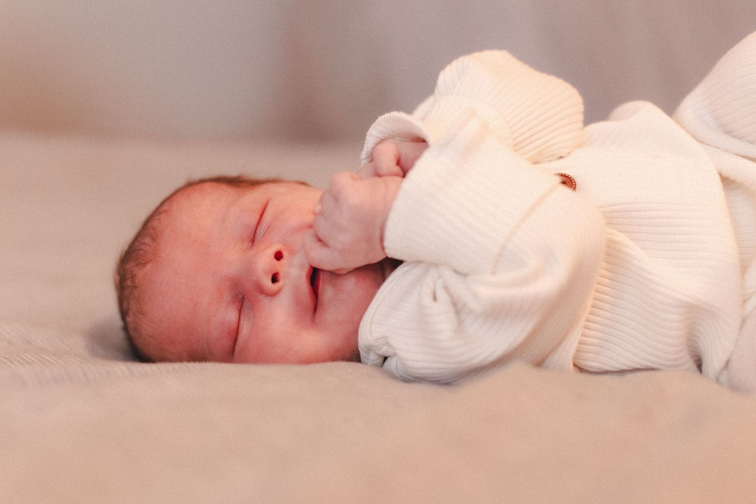 Newborn baby naps during newborn photography session