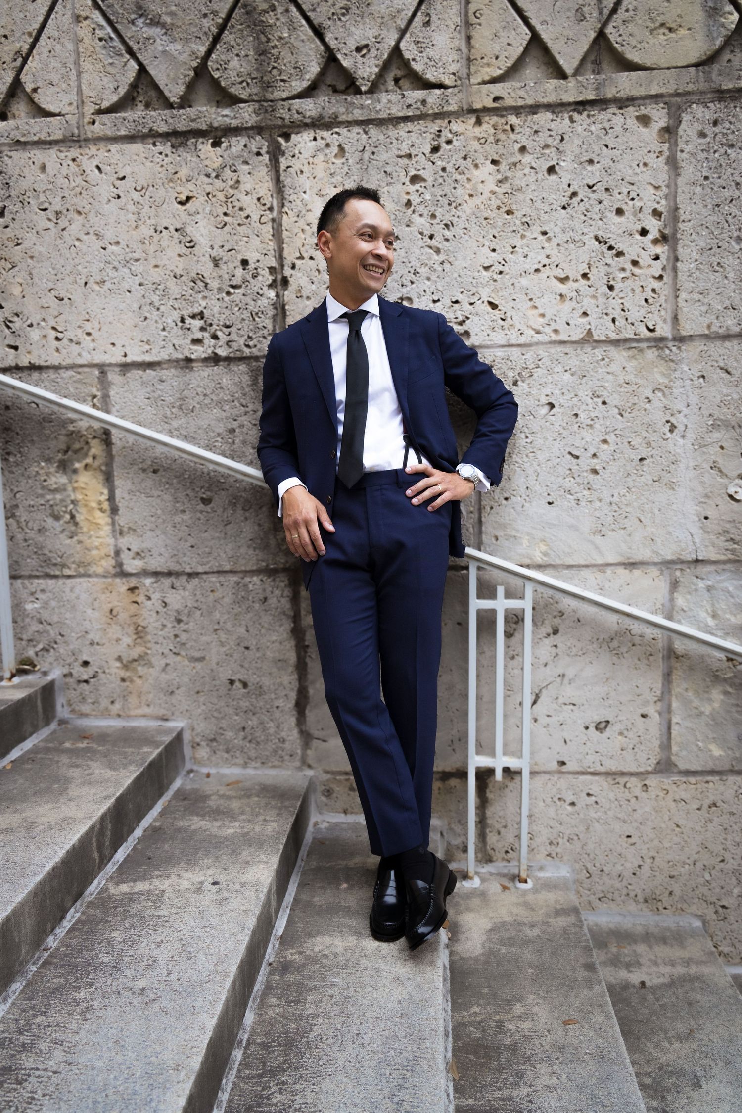 Groom portrait on limestone stairs in Austin Texas