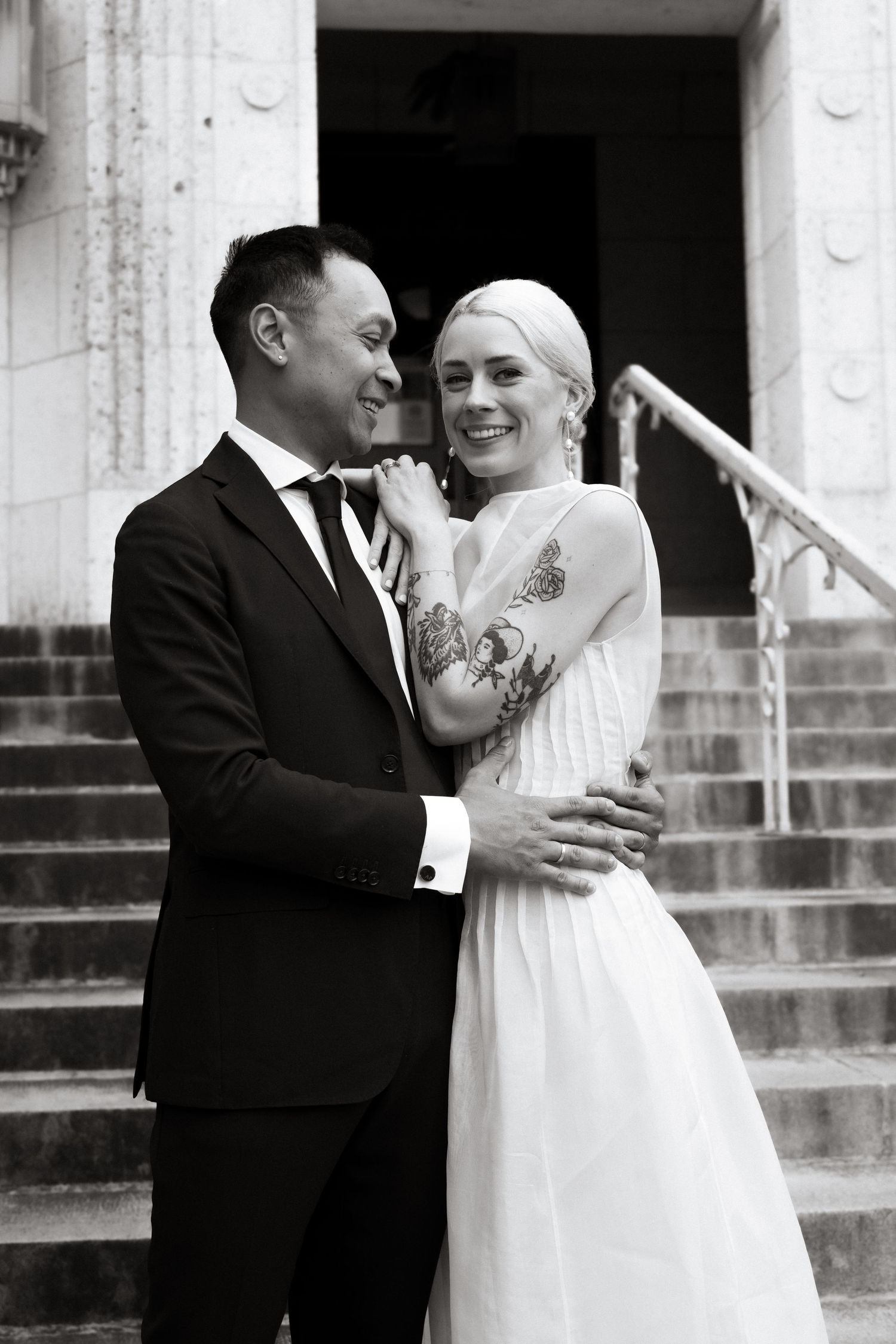 Courthouse wedding bride and groom on steps of Travis County Courthouse in Austin Texas