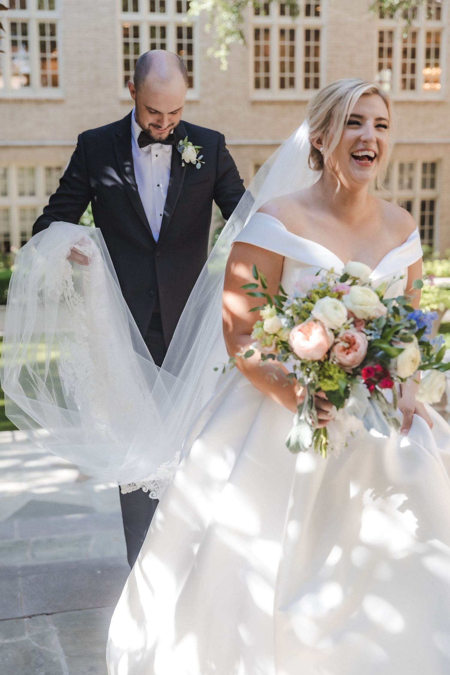 Groom helps bride with train and veil | Dallas, Texas | Highland Park United Methodist Church