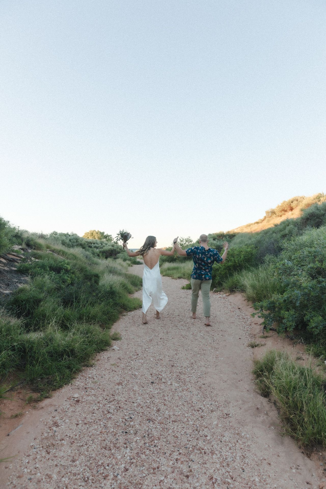 Couple celebrates after sunset elopement wedding ceremony