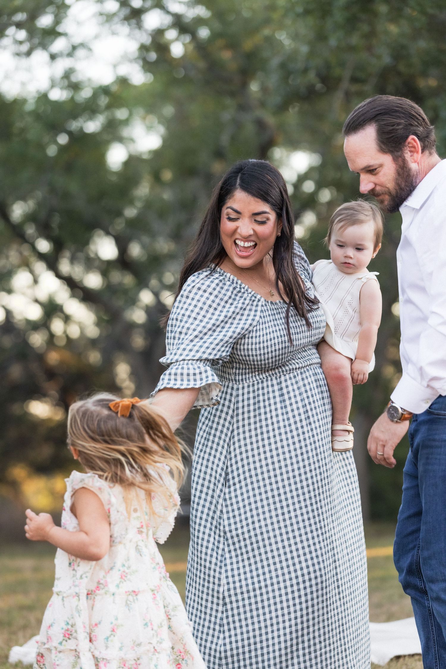 Family plays outside during family photography session | Texas Hill Country