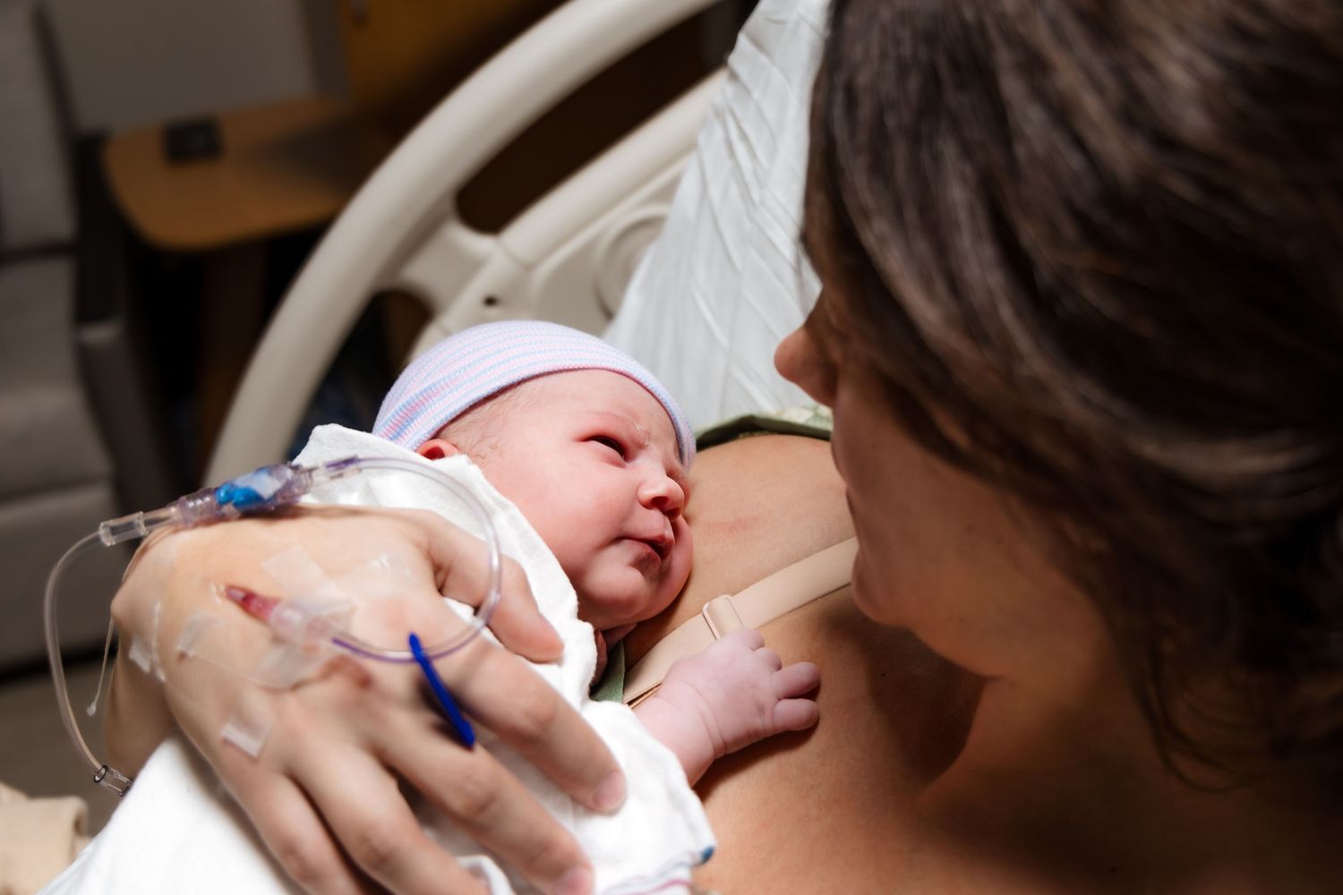 Newborn baby's first look at mom, moments after being born.
