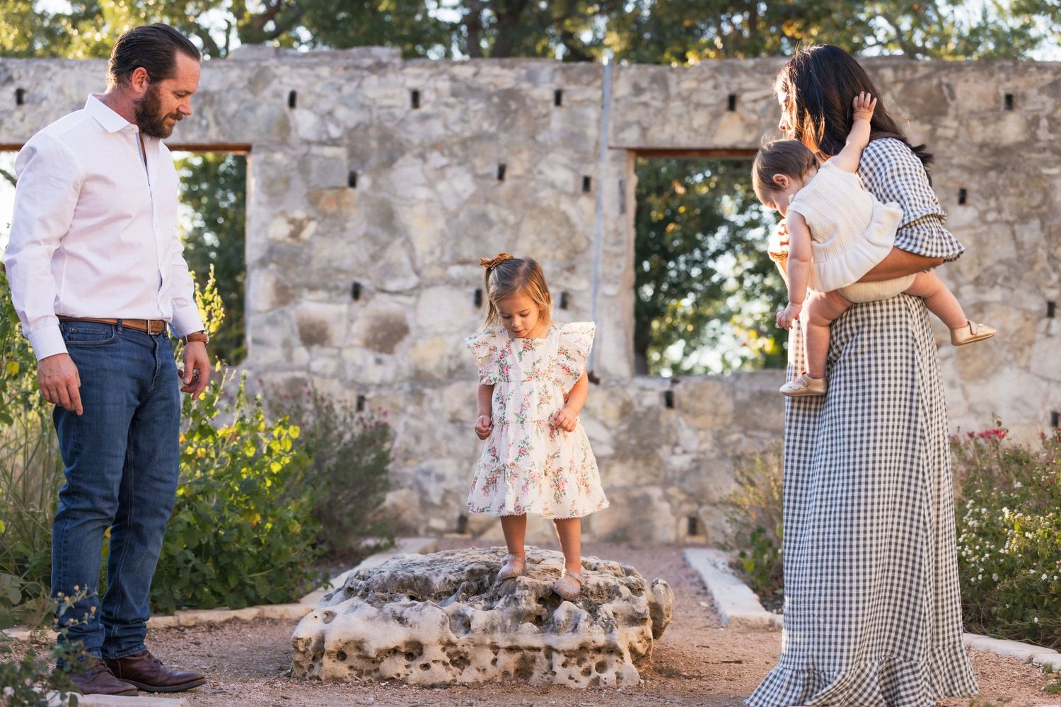 Family plays together during sunset family photography session | Dripping Springs, Texas Hill Country