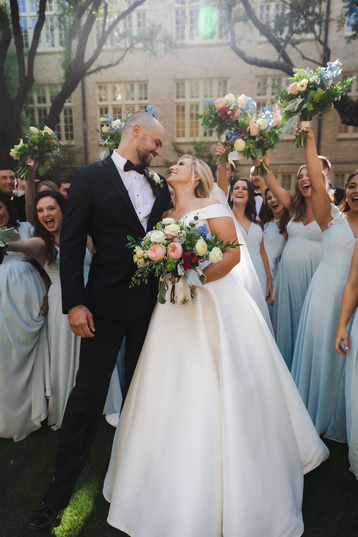 Bride and groom celebrate with wedding party | Dallas, Texas | Highland Park United Methodist Church