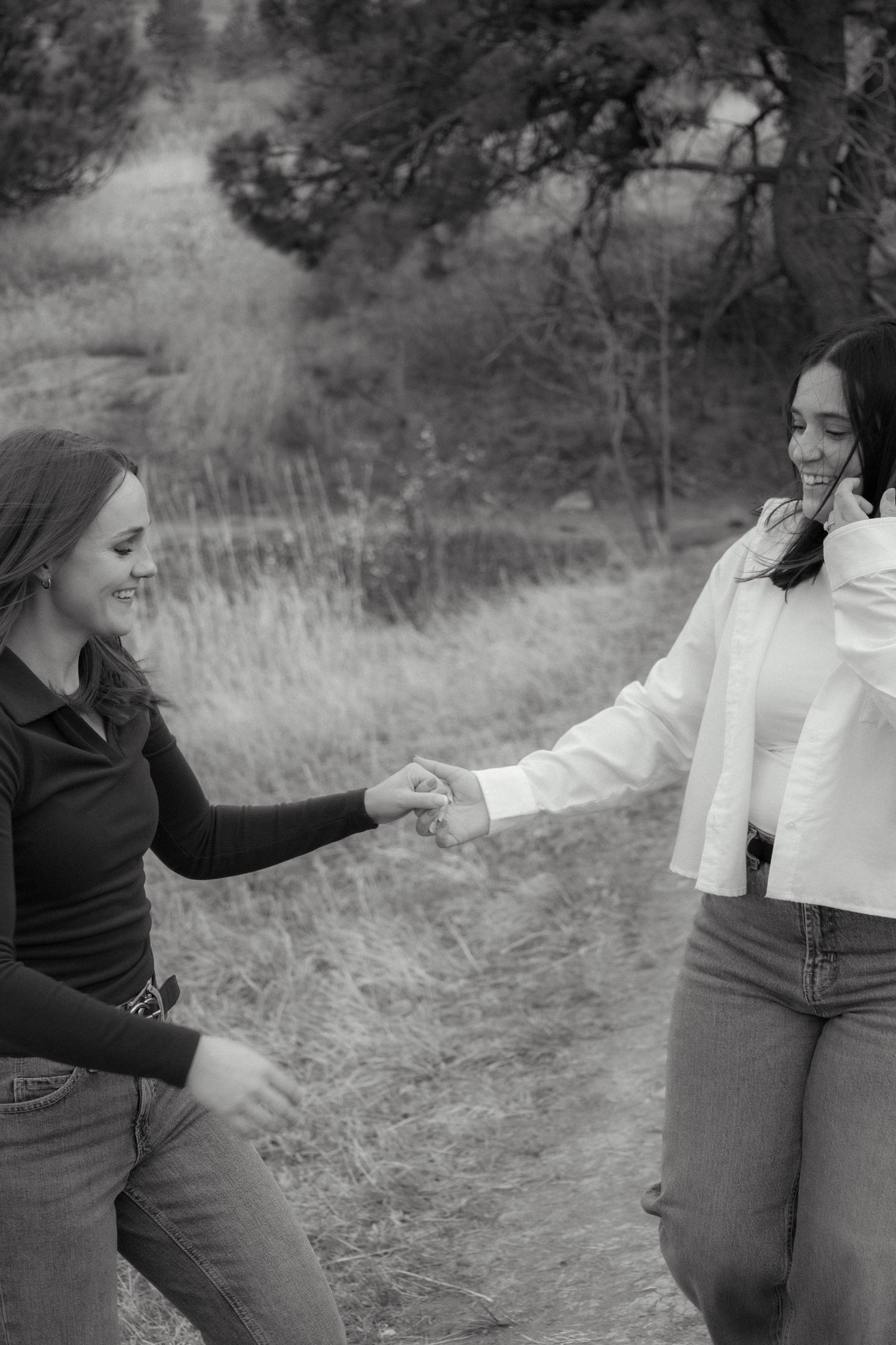a black and white photo of a couple holding hands in Boulder, Colorado