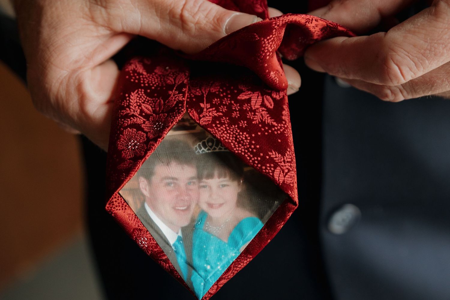 Heart-shaped ornament held against blurred background.