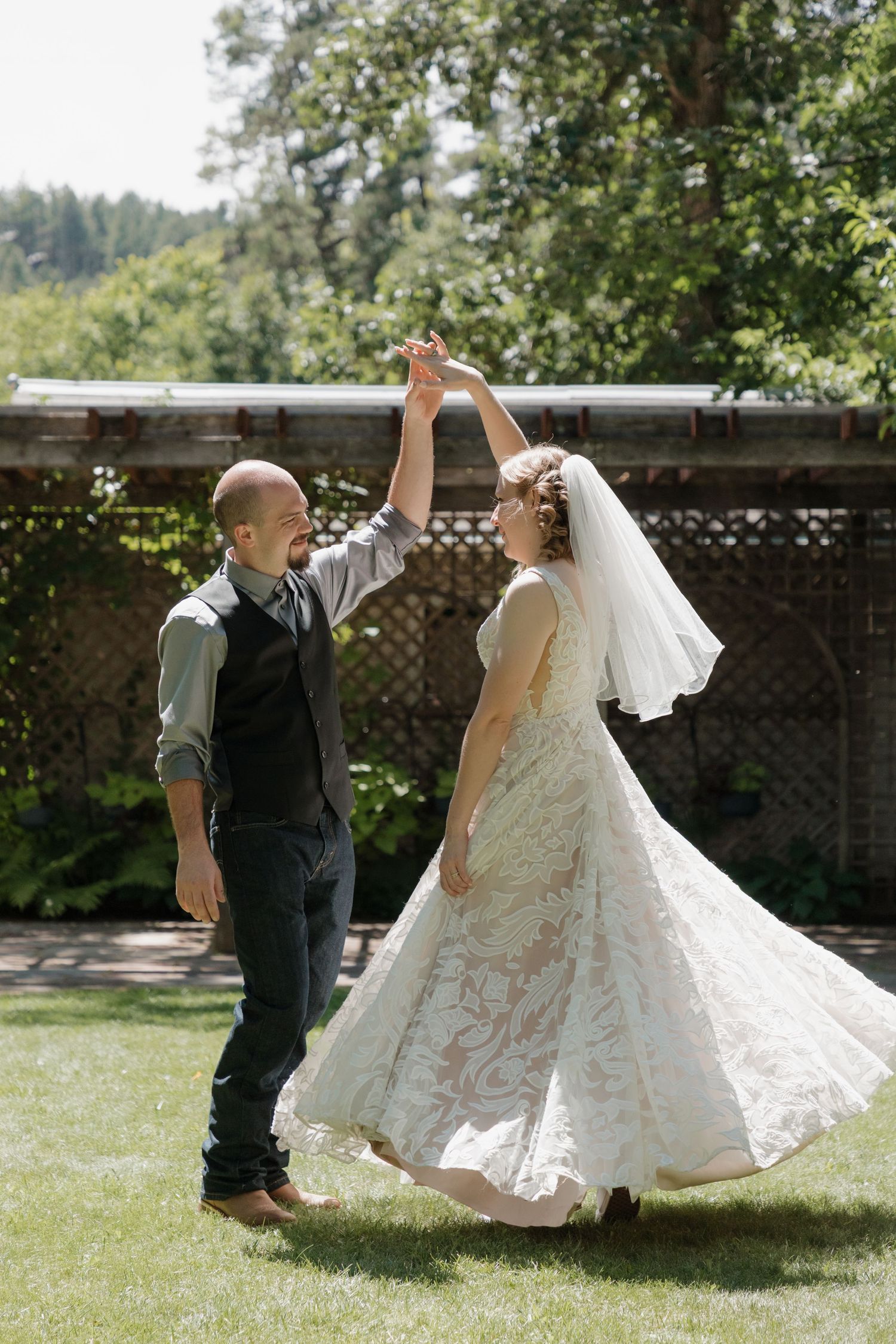 A playful sequence of wedding photos showing a couple dancing and twirling in a sunny garden setting.