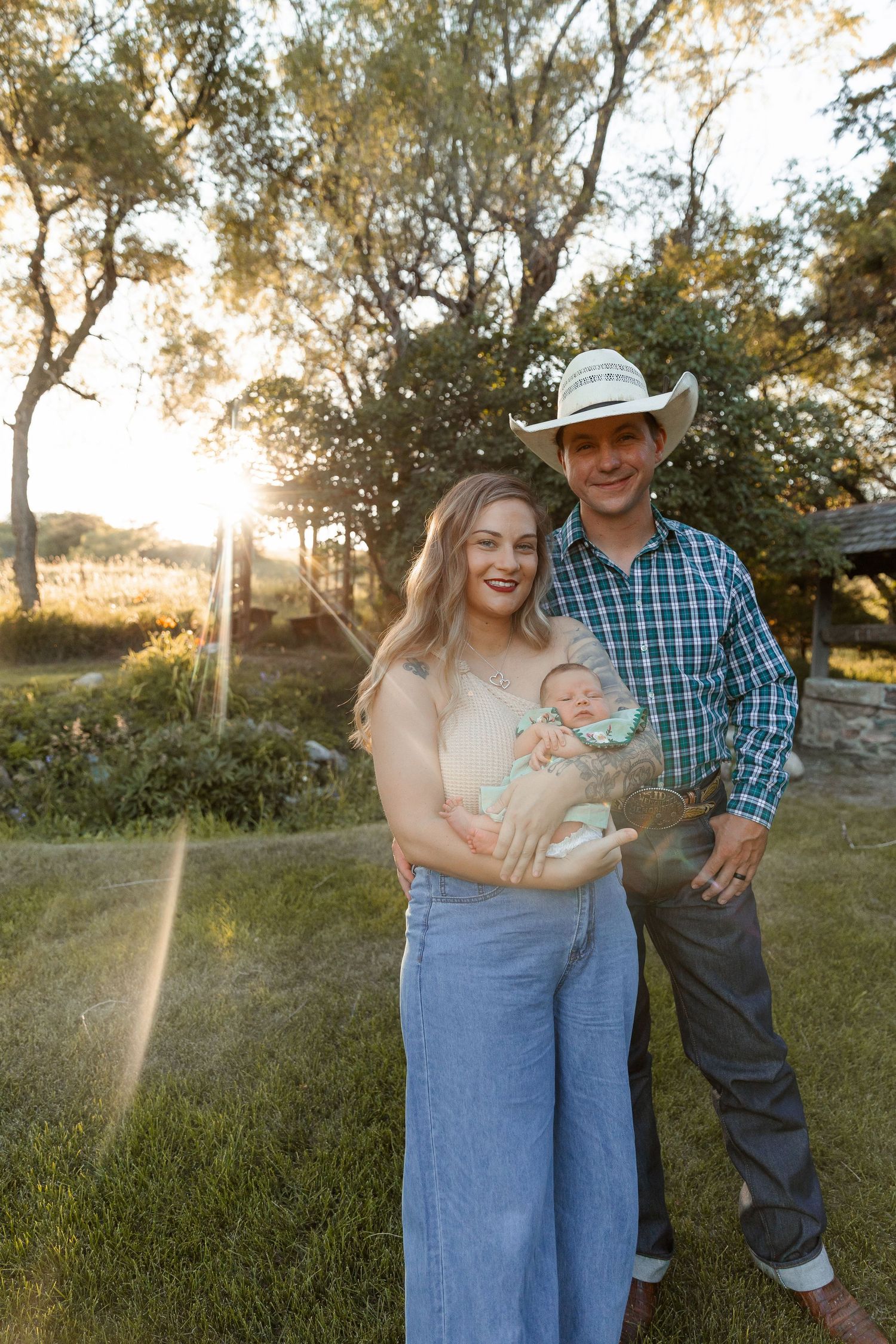 Family enjoying golden hour moments together in rustic outdoor setting.