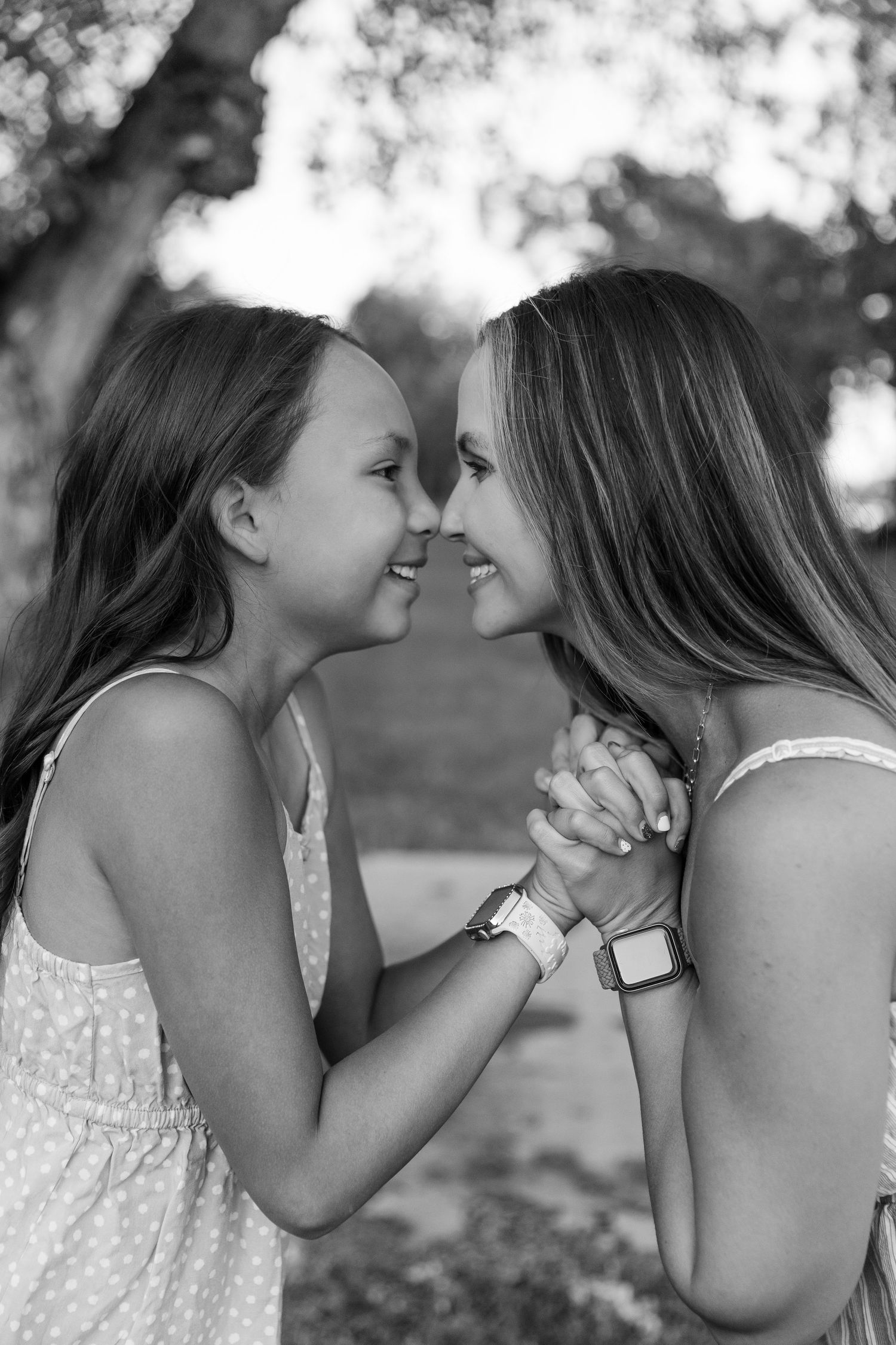 Sweet black and white portraits showing tender moments outdoors.