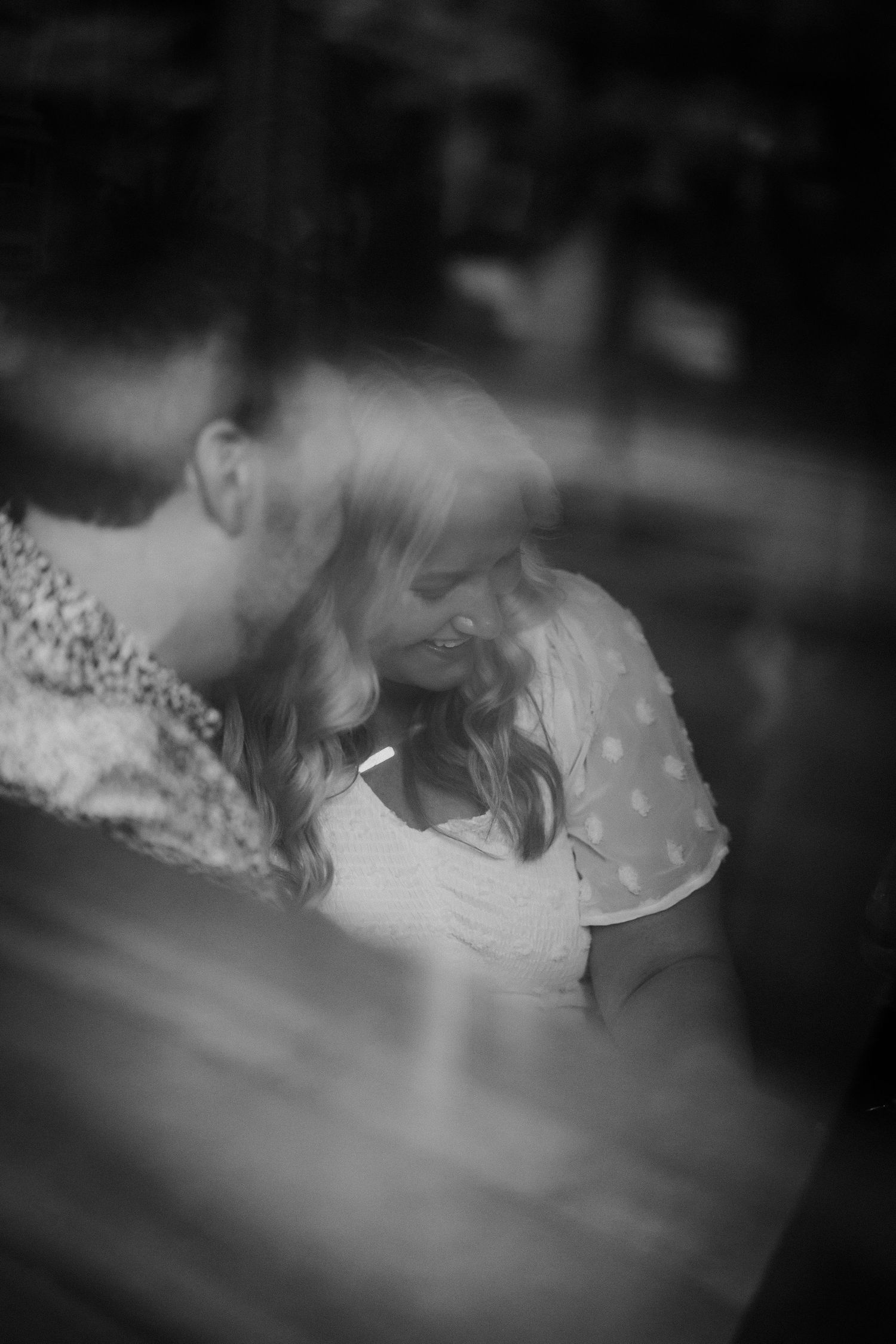 A romantic black and white photo sequence showing an intimate embrace between a couple.