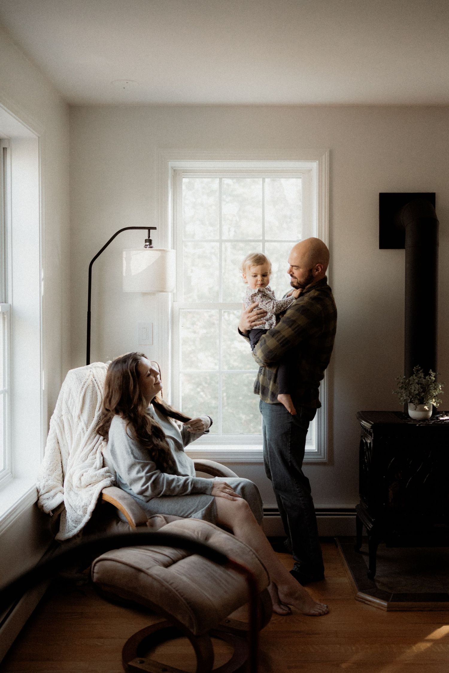 Candid lifestyle photos showing playtime and interaction in a bright, minimalist room.