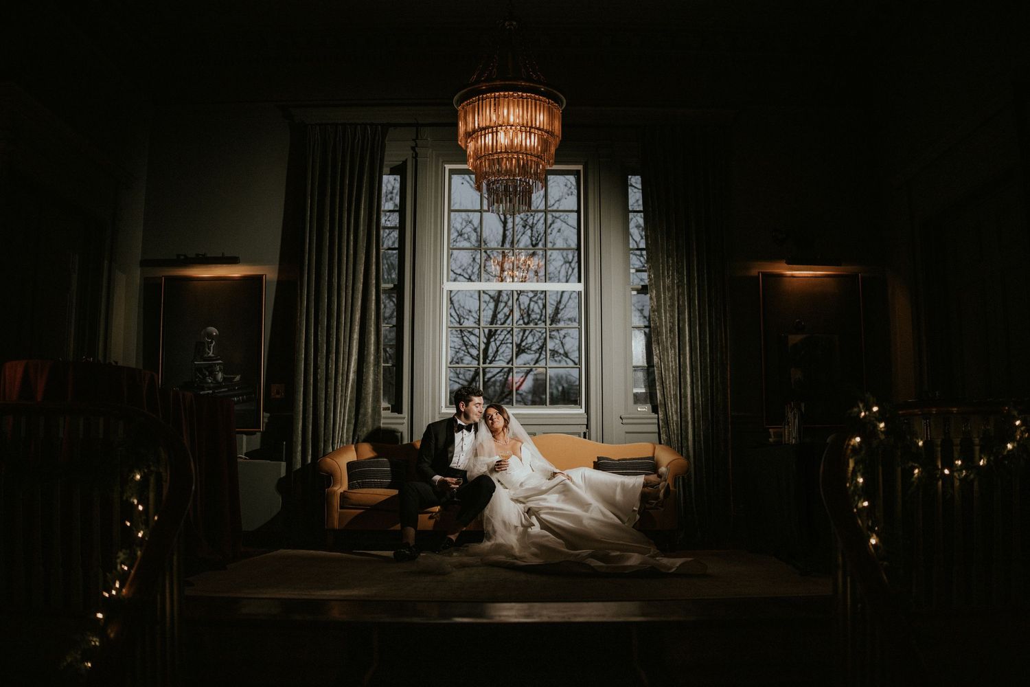 A collection of dark and moody wedding photography shots showcasing dramatic lighting and silhouettes in indoor settings.