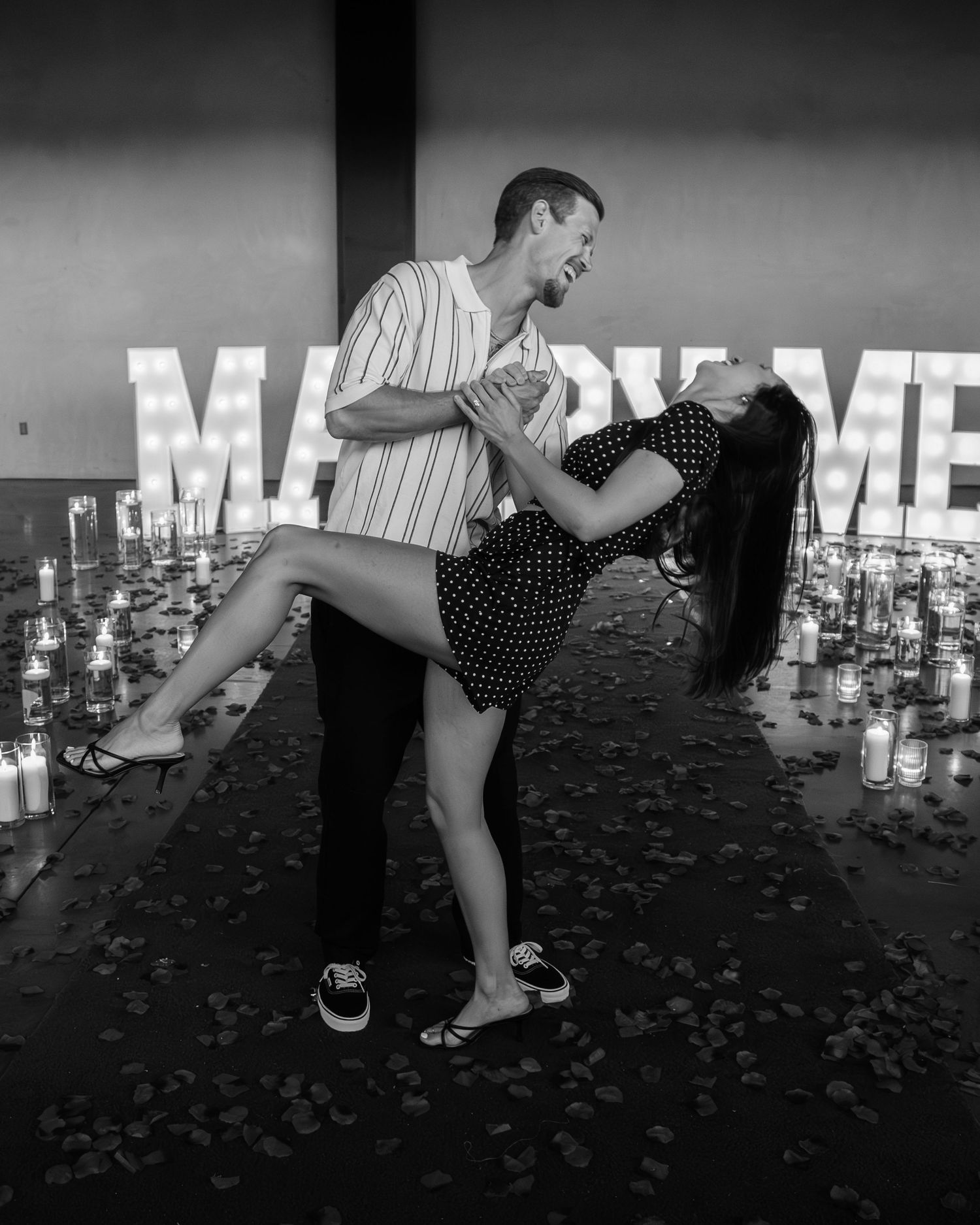 Black and white photo of couple dancing near 