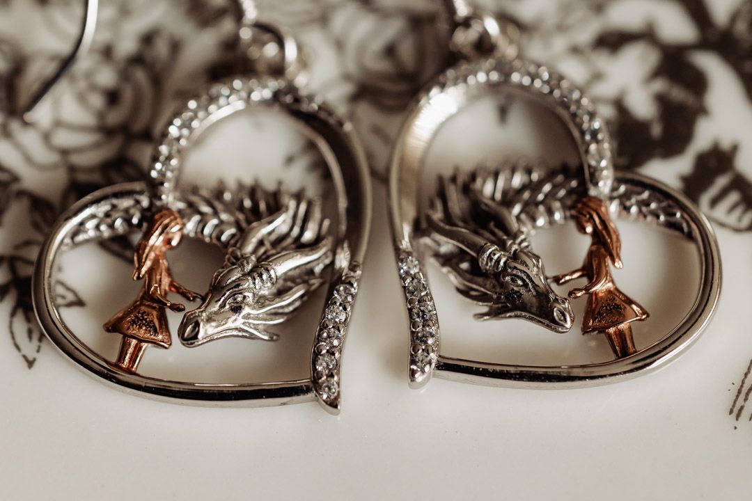 Heart-shaped wedding jewelry with delicate fairy details and diamond accents.