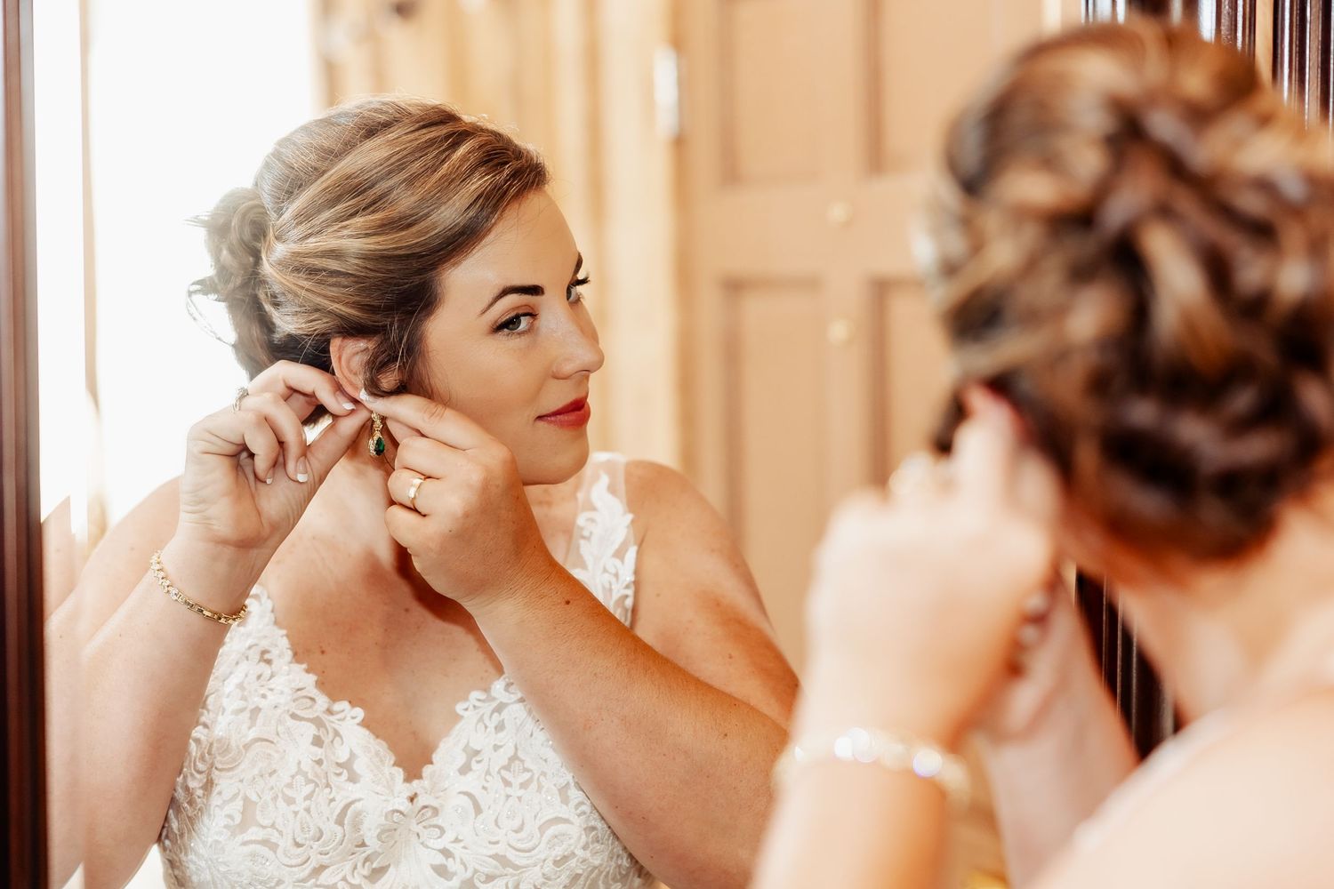 Elegant bridal preparation scene with jewelry and lace details.