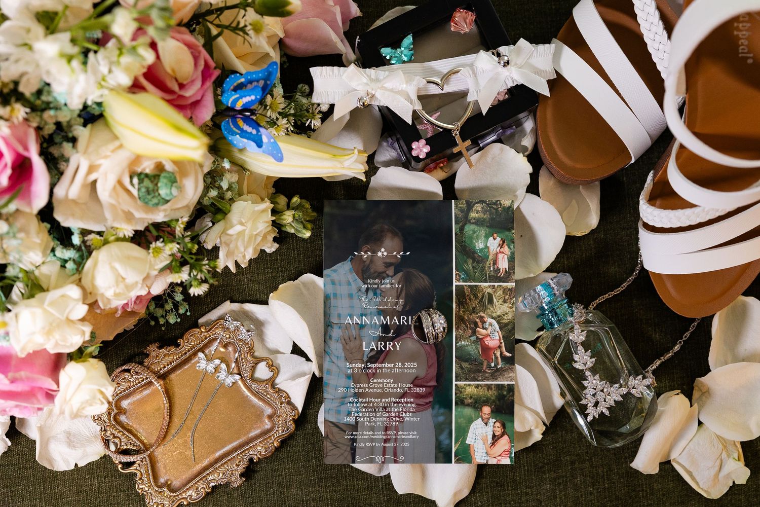 Wedding flat lay featuring floral bouquet, invitation, photo charms, perfume bottle, and strappy heels.