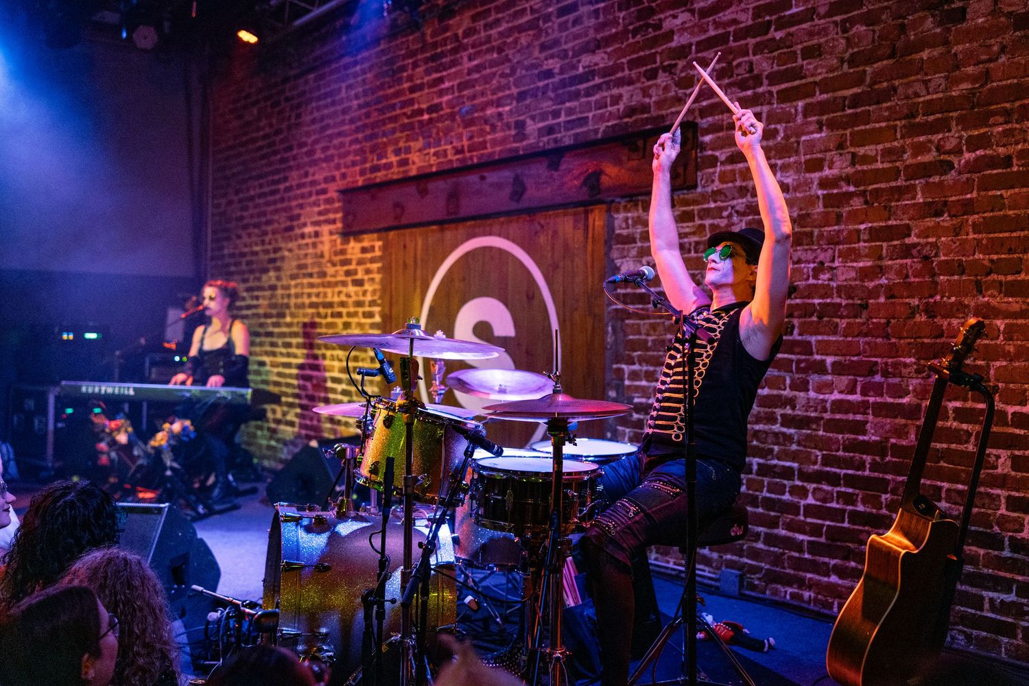 Brian Viglione, Dresden Dolls, The Social Orlando FL, June 18 2023, drumming arms raised, Amanda Palmer in background