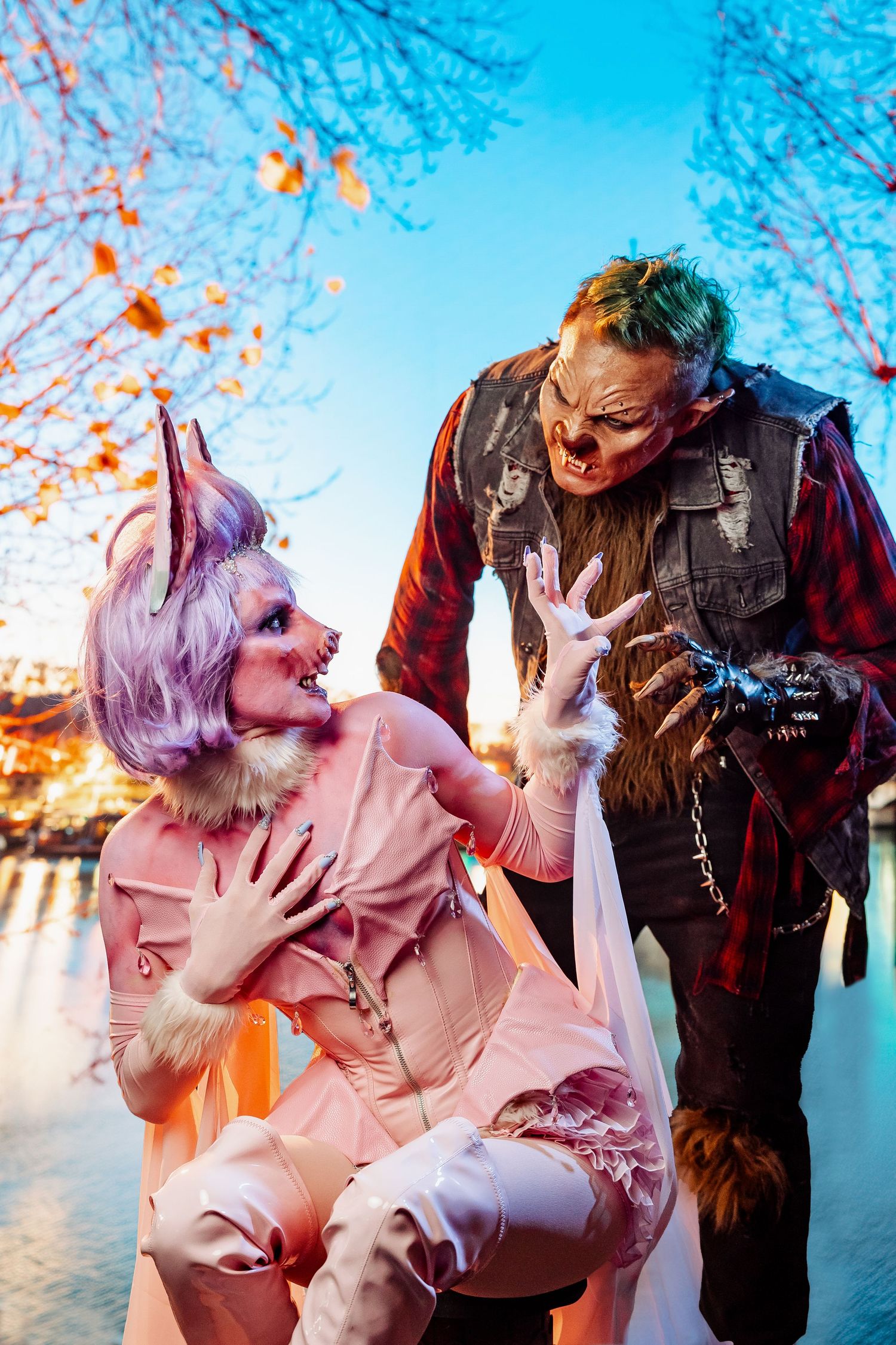 Fantasy creature photoshoot with pink and purple styling in outdoor winter setting.