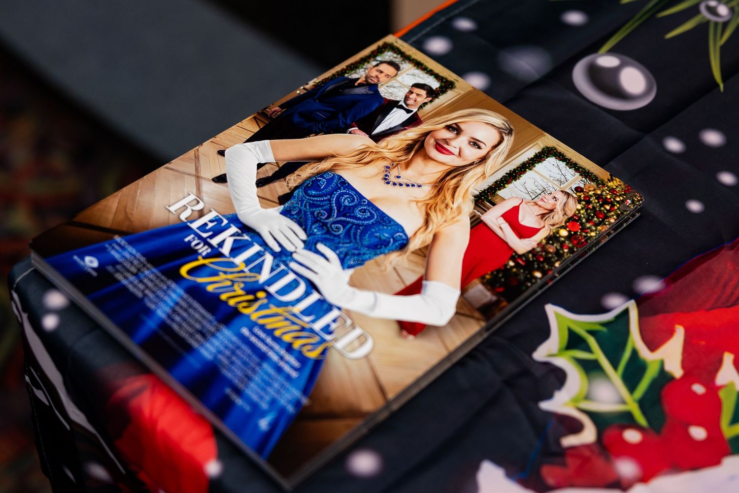 Rekindled for Christmas movie promotional magazine on a festive holiday-themed table display.