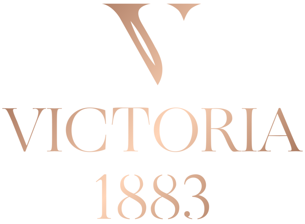 Victoria 1883 elegant rose gold logo with stylized V monogram and serif typography on white background.