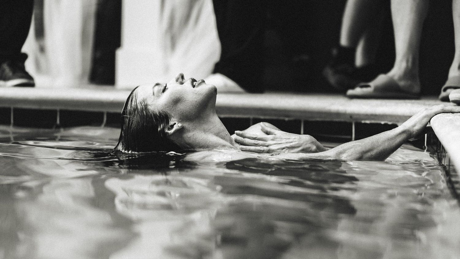 Vintage black and white swimming pool photograph showing classic floating pose.