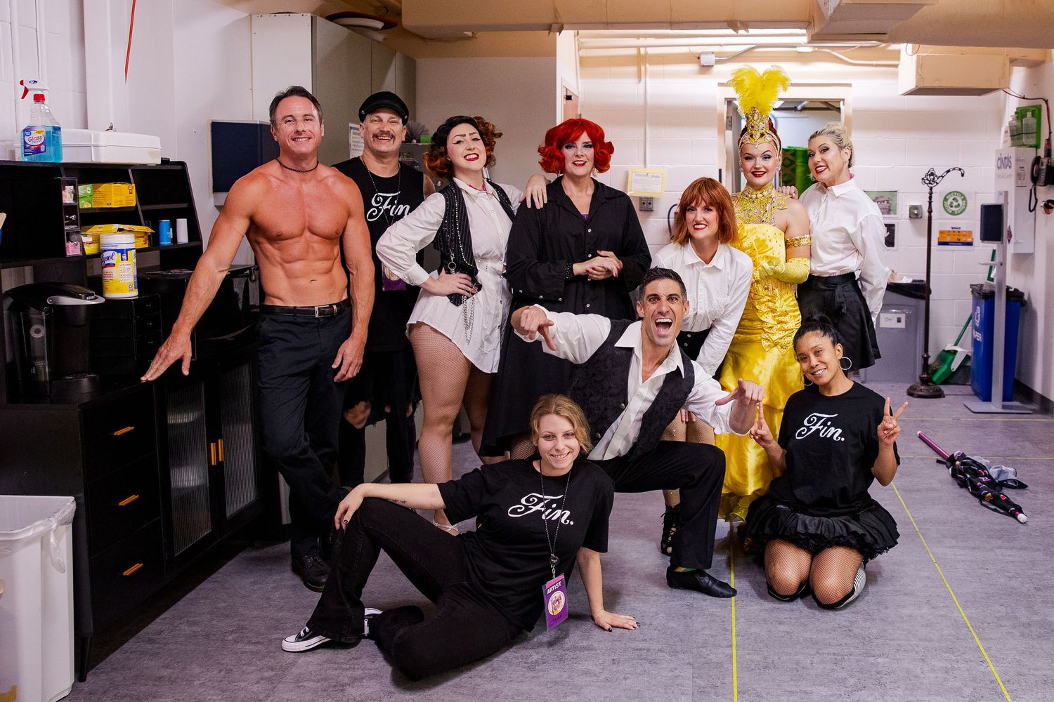 Group of performers posing backstage for Carsets and Cuties show photo.