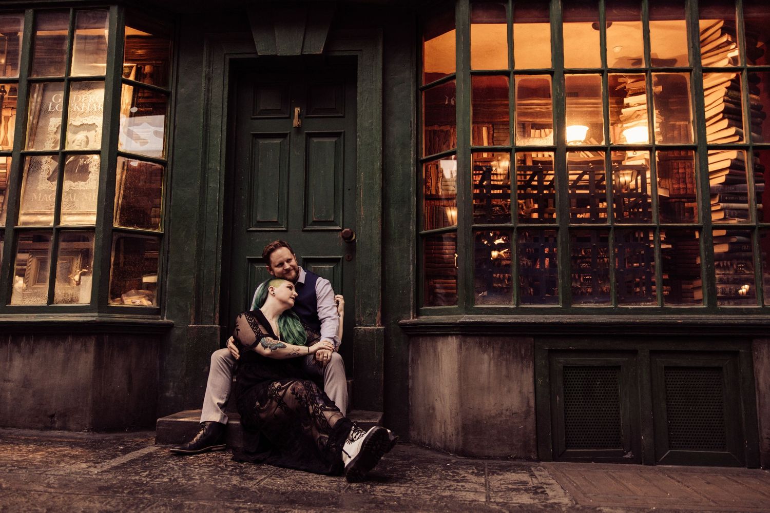 A vintage-styled scene outside an antique shop with illuminated windows at twilight.