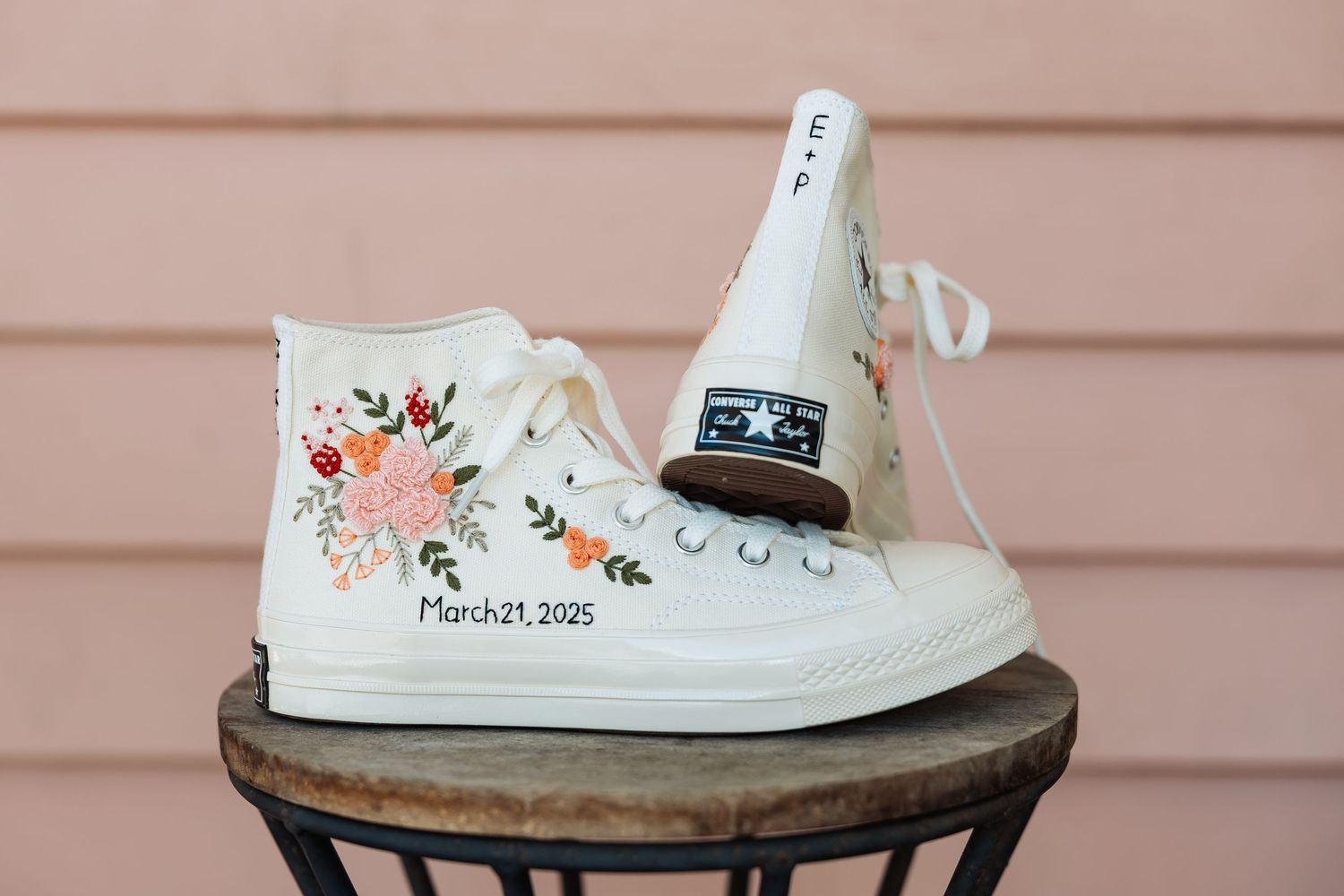 Custom white Converse high-tops with hand-embroidered floral design and March 21, 2025 date.