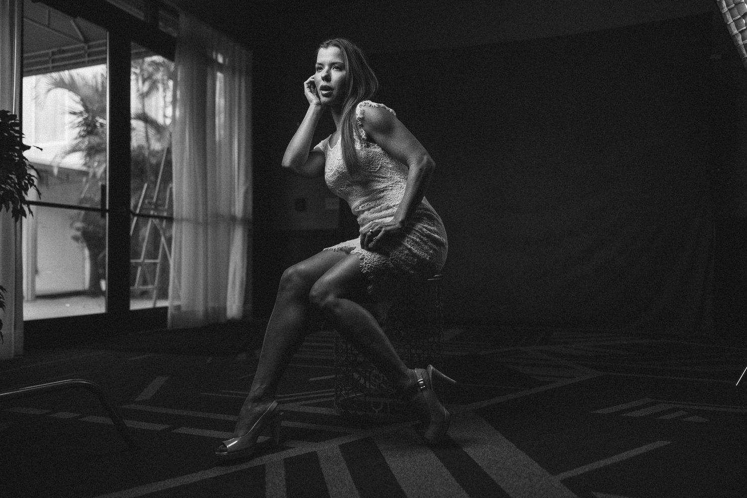 Dramatic black and white photo of dancer in mid-performance.