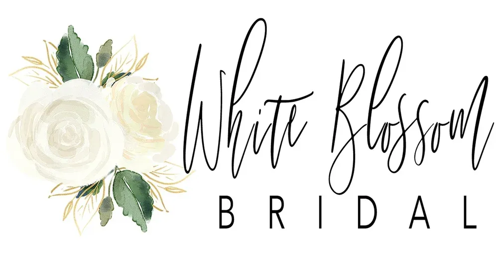 White Blossom Bridal logo featuring elegant script text with white roses and green leaves floral arrangement.
