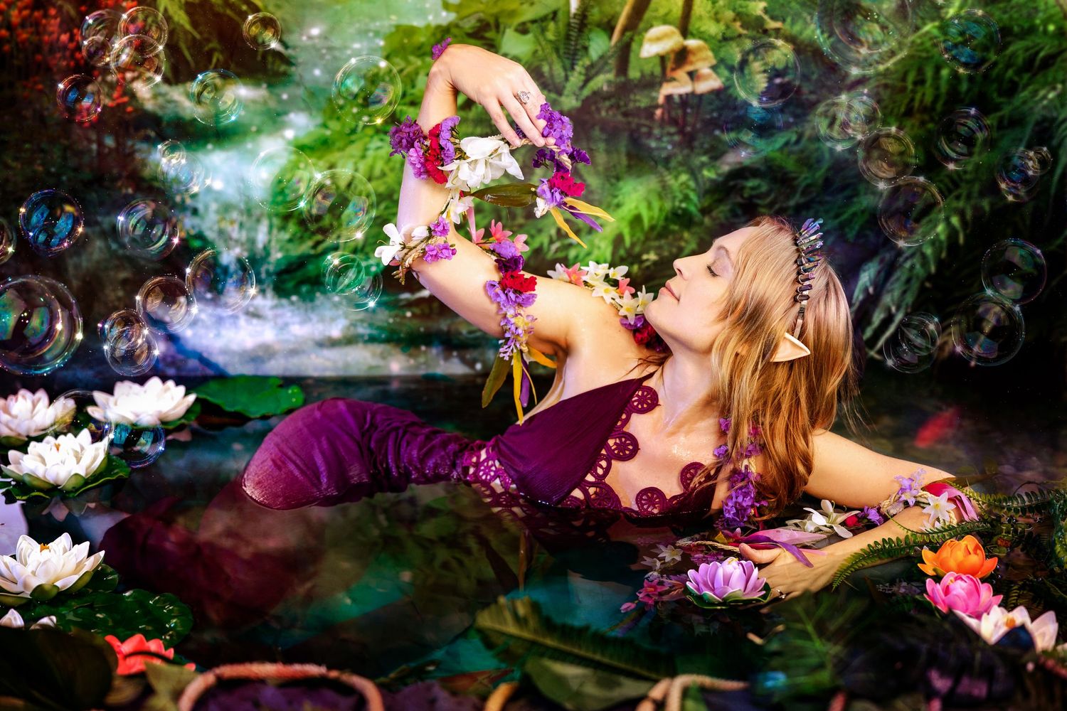 A woman in purple dress lies in enchanted pond with colorful flowers and bubbles in fantasy forest setting.
