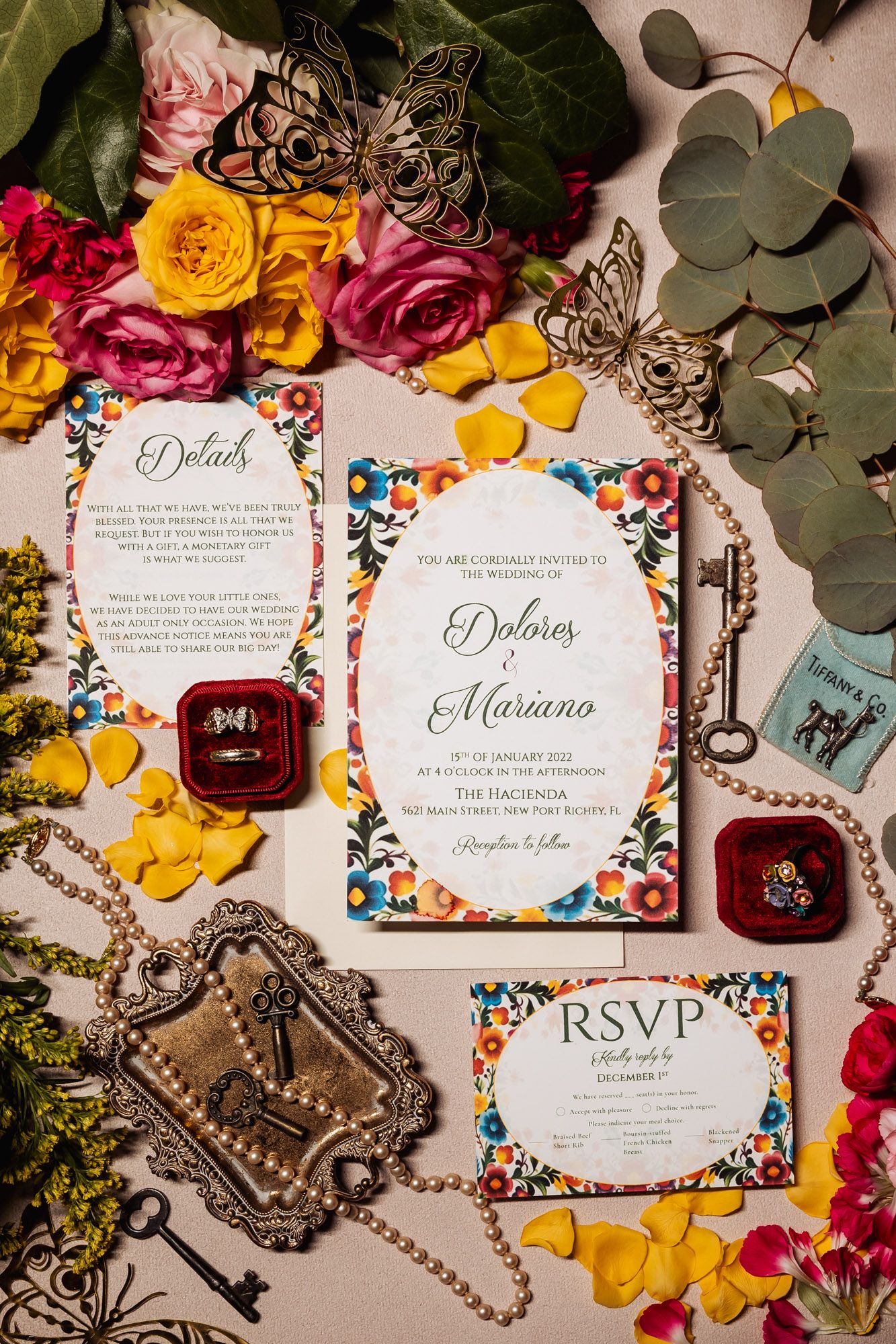 Elegant floral wedding invitation suite for Dolores and Mariano with vintage keys and pearls.